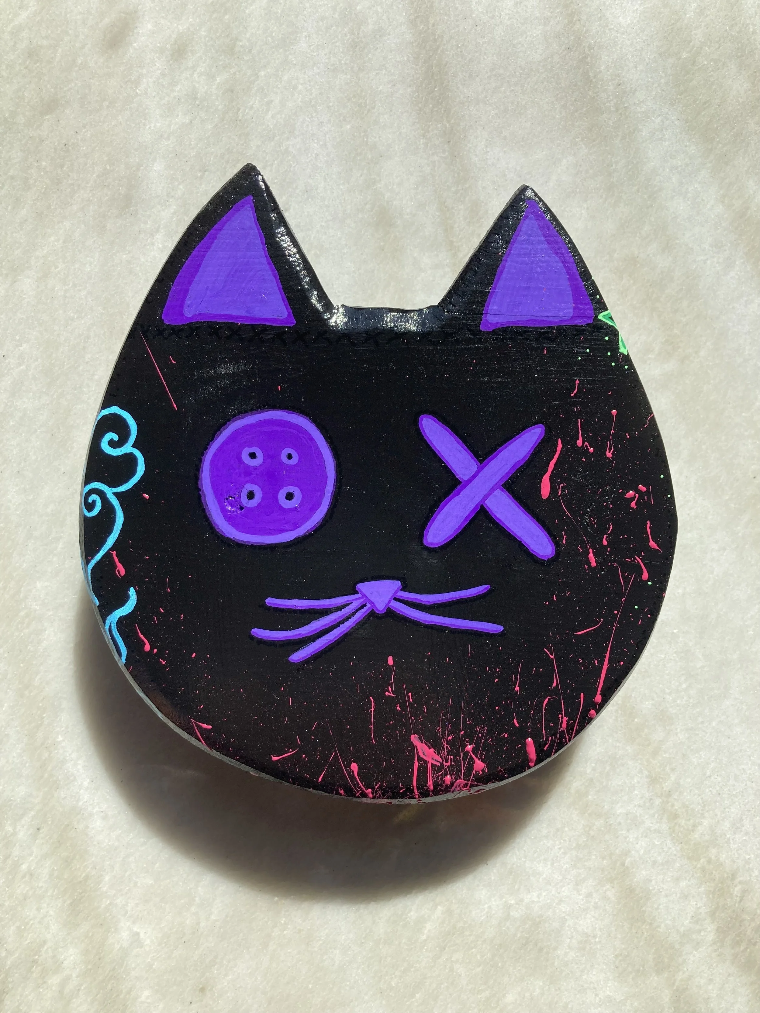 Painted cat head art.