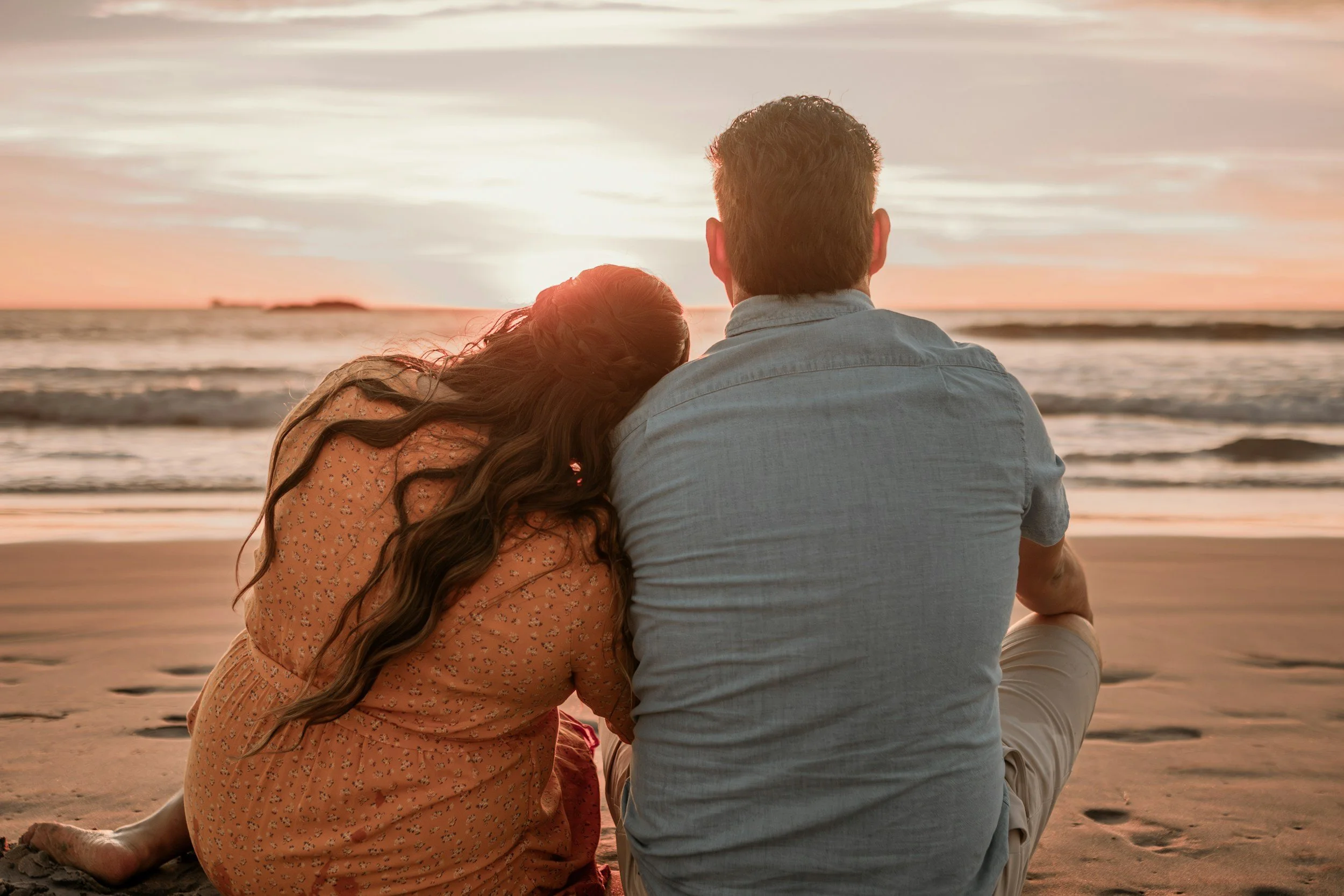 Couple sitting together at sunset considering whether to stay or separate during a discernment intensive retreat in St. Petersburg, Florida