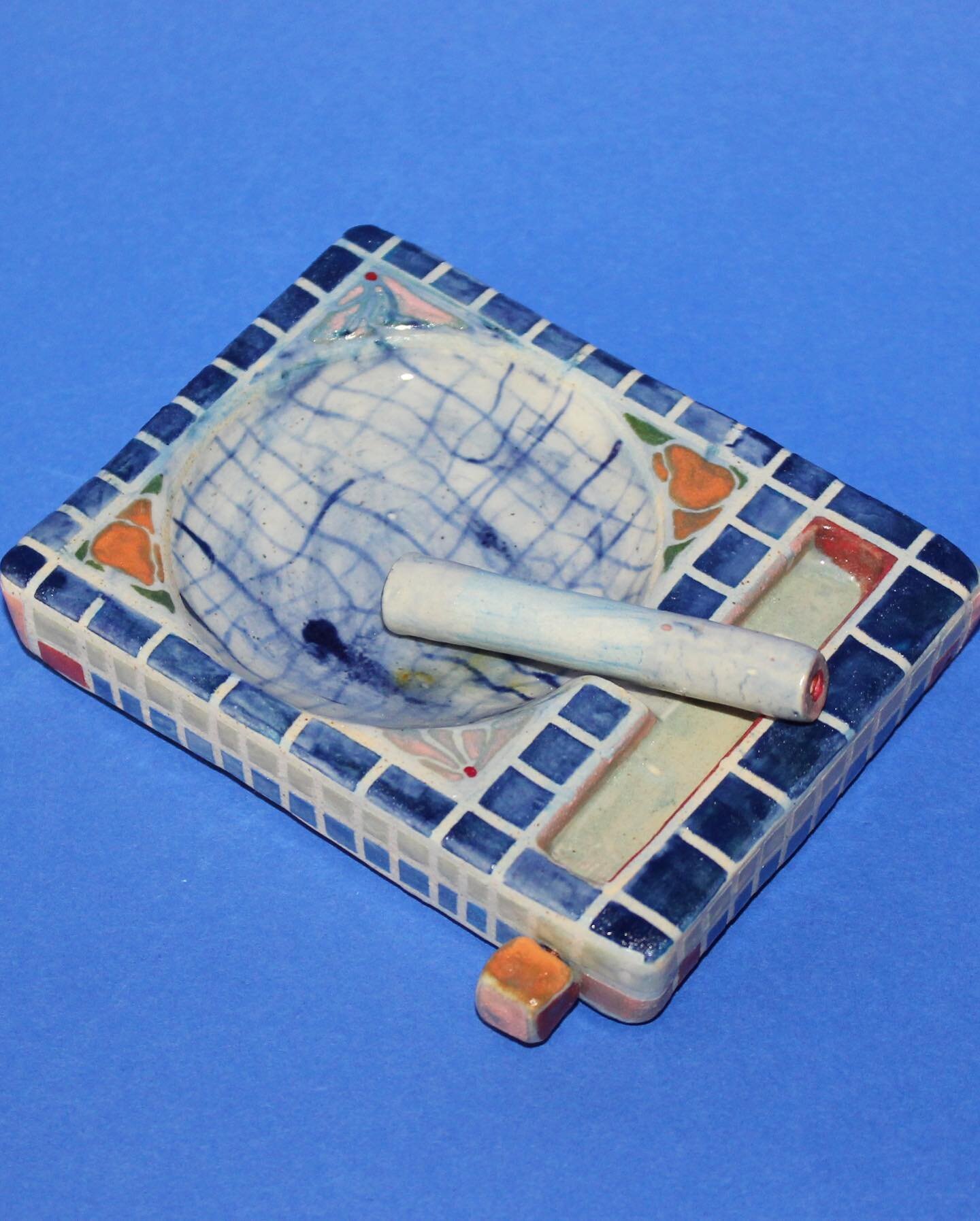 Sardinia Ashtray Set: ashtray, one hitter and cocktail pick stored in the side for emptying the one hitter 💙 
available @ 4:30pm
I&rsquo;ve never been to Sardinia but when I paint, I dream 🌊💭🌺 + a 2021 l00k that feels dreaming