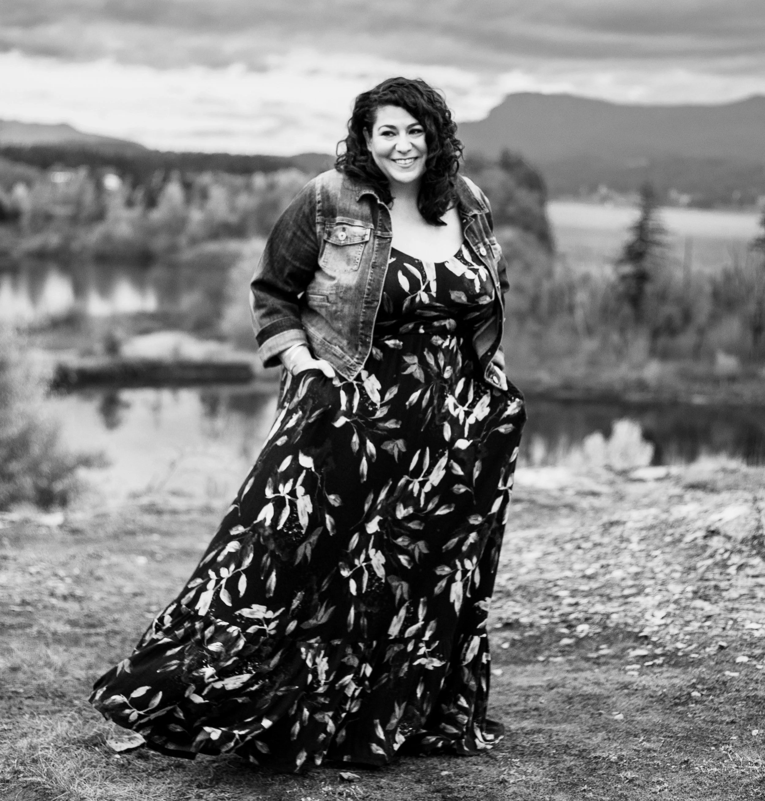 Woman standing outside smiling and looking confident