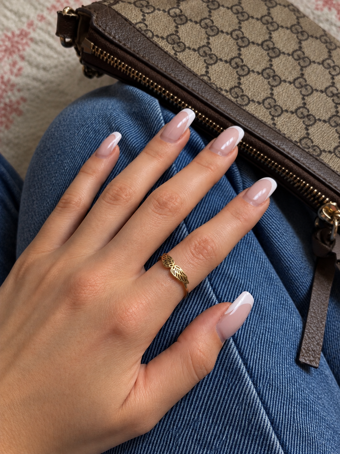 French Manicure and Gold Wing Ring (1).png