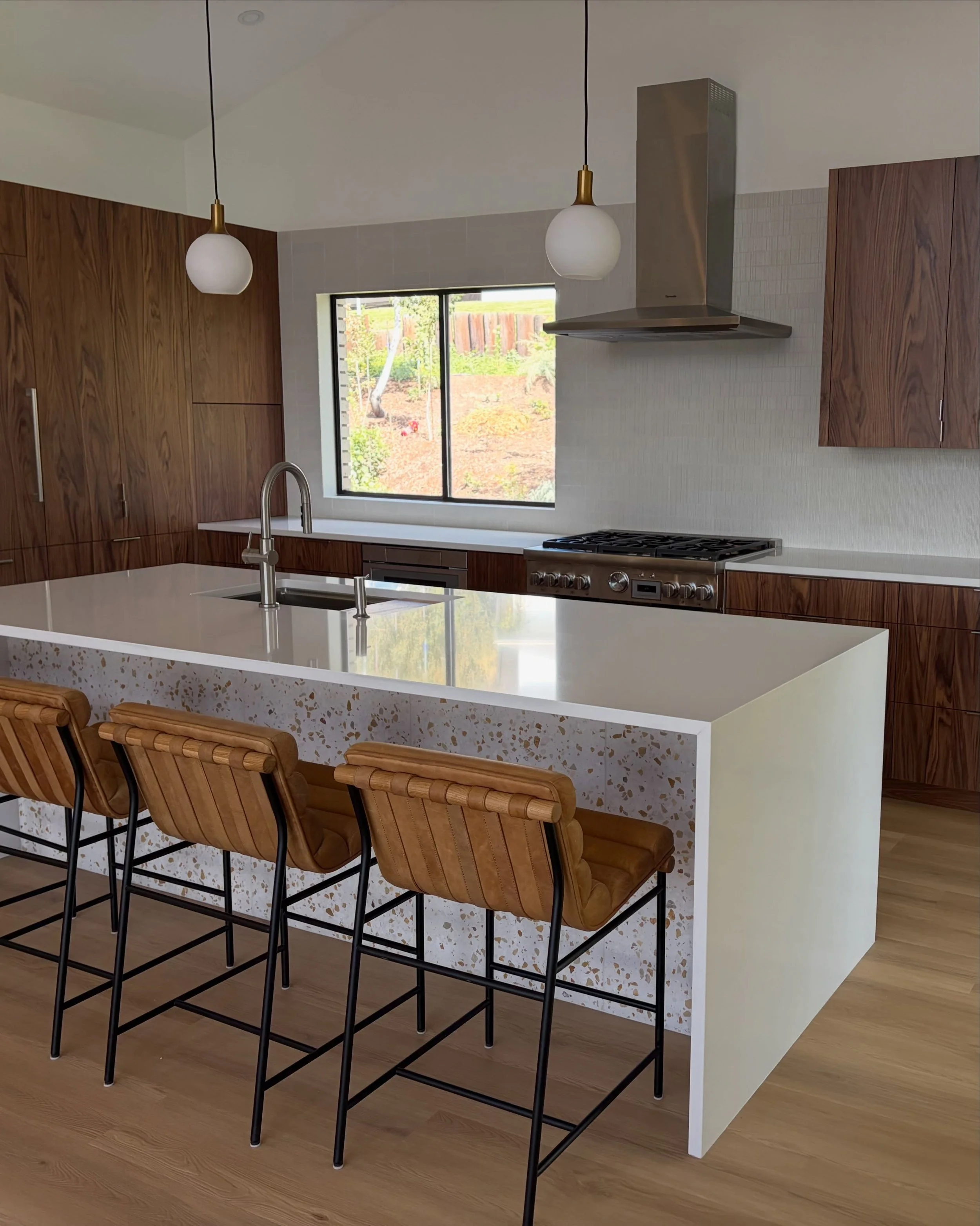 A few client snaps from Utah in her newly finished kitchen. This mid-century house had all the best bones (exposed ridge beam, tons of windows/natural light, rough rock wall fireplaces that served as an anchor for the palette), so it felt great inser