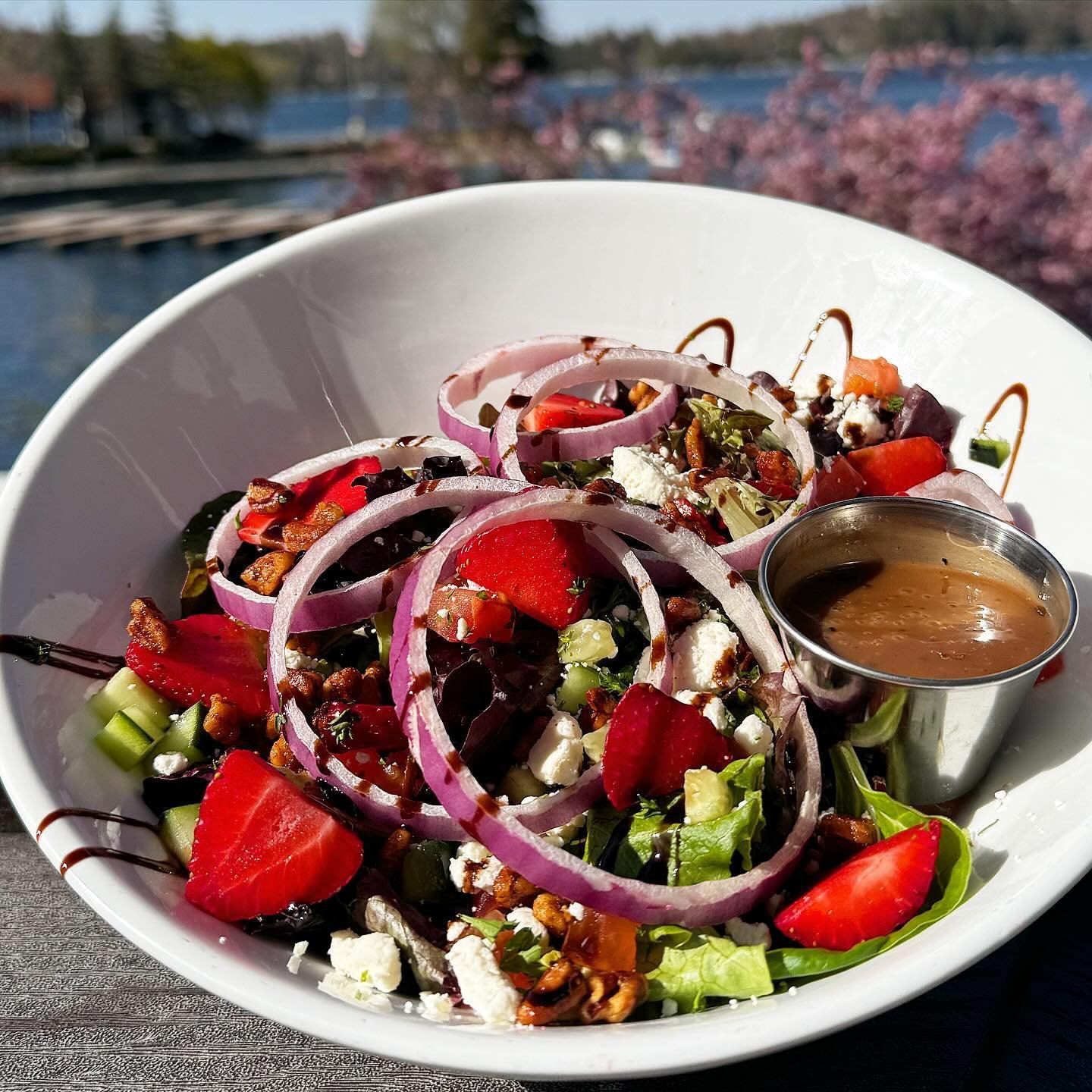 🥗 Our new #seasonalsalad has arrived! 🍓Treat your tastebuds to refreshing mixed greens, diced red onions, tomatoes, cucumbers, feta, sliced strawberries, candied pecans, a drizzle of balsamic glaze and a dressing of your choice. It&rsquo;s the perf