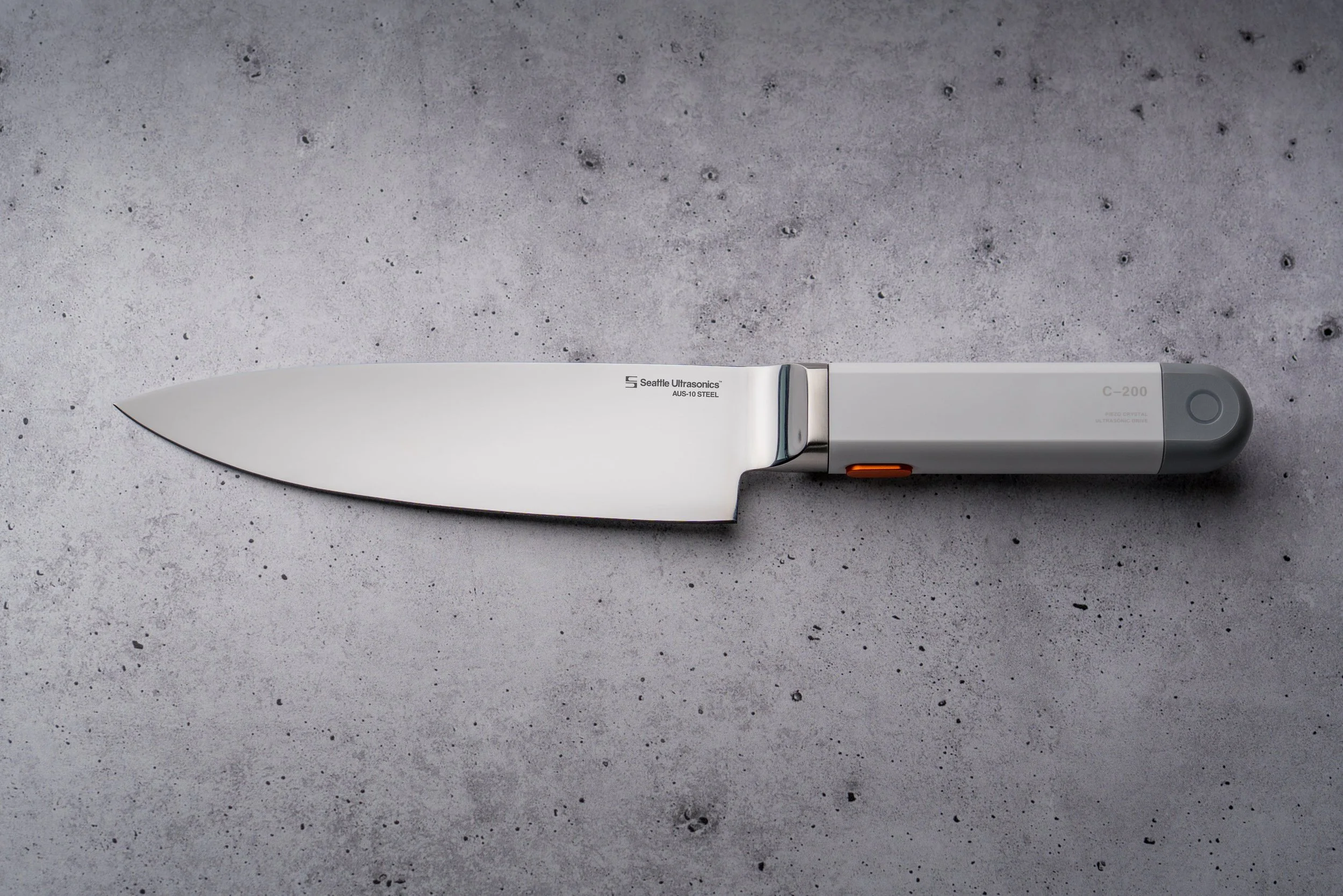 Modern electric kitchen knife with a white handle and gray end cap on a white background.