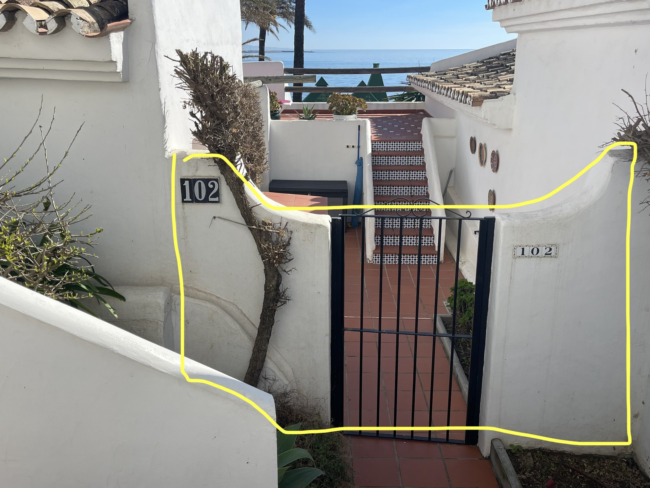 Wall and gate restricting access to common terrace