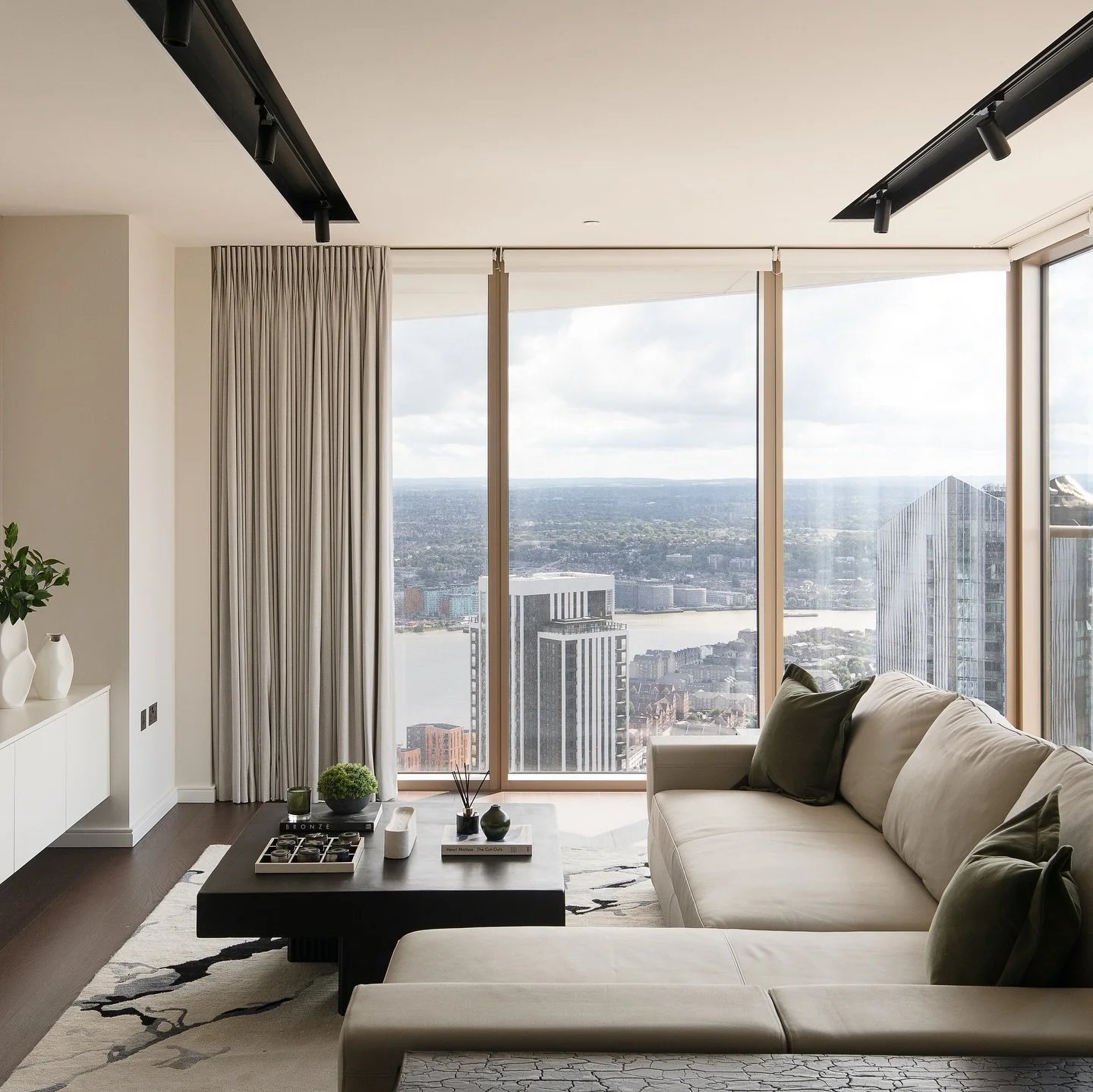 The brief: Create a minimalist, modern space with a calming feel.

With a special request from the client to reduce the amount of fabrics used due to allergies, we curated a paired-back palette which included a leather sofa, textured leather wall cov