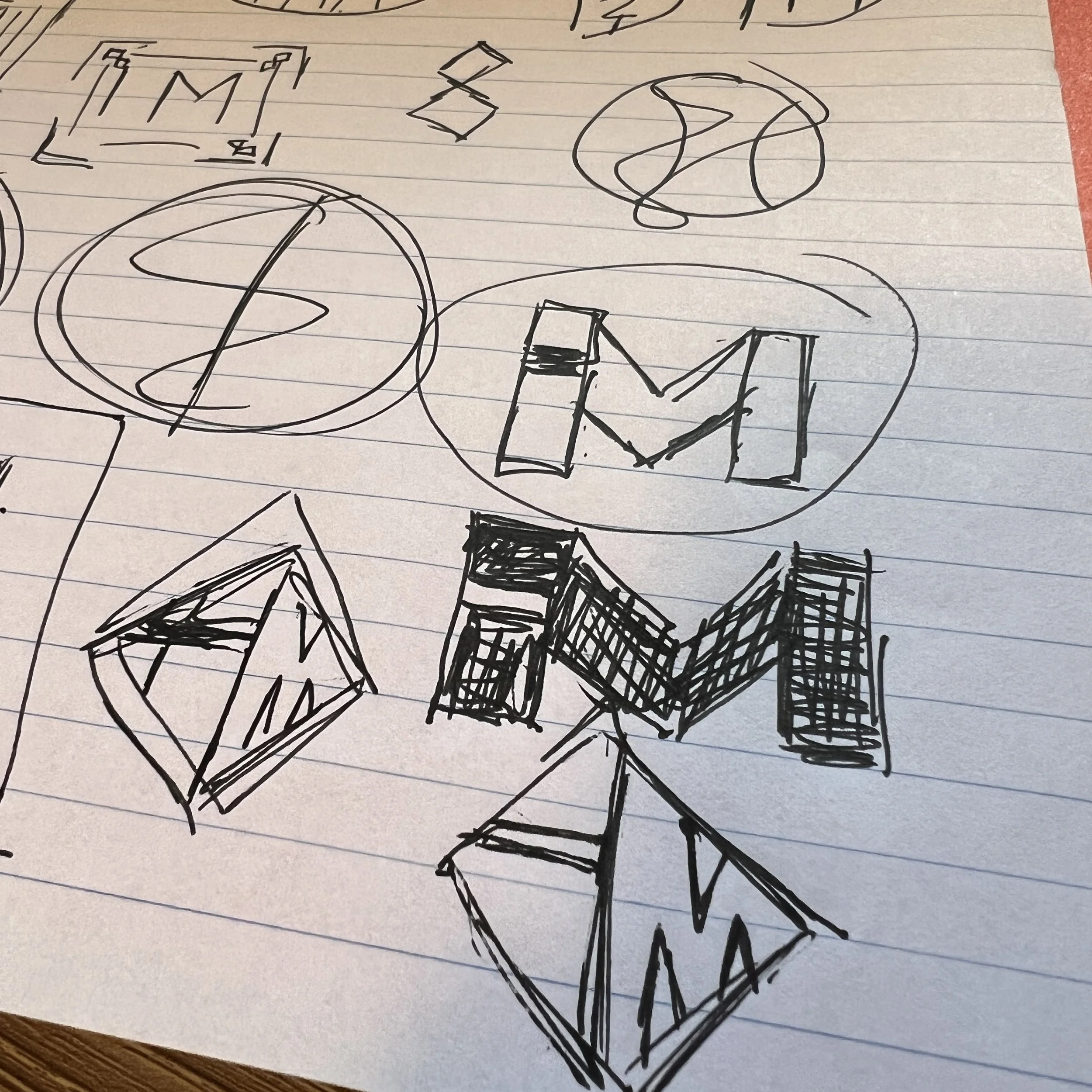 A page of rough logo concept sketches