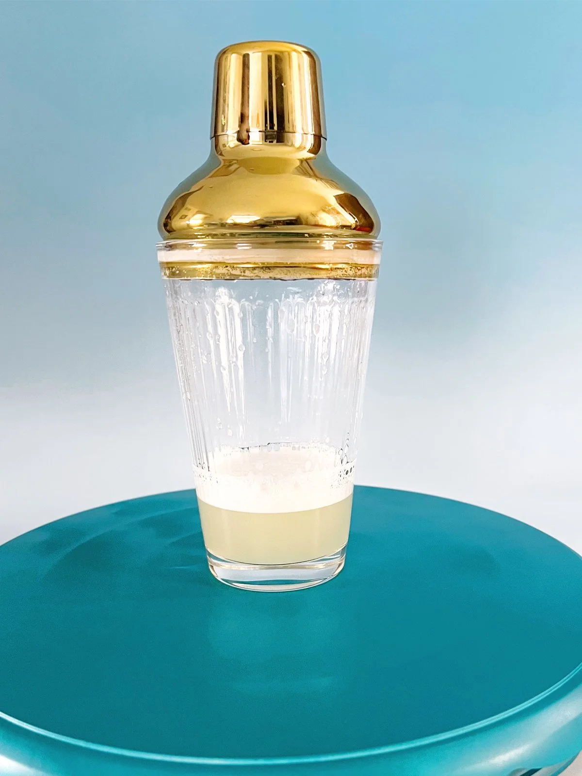 shaker with lemon and simple syrup