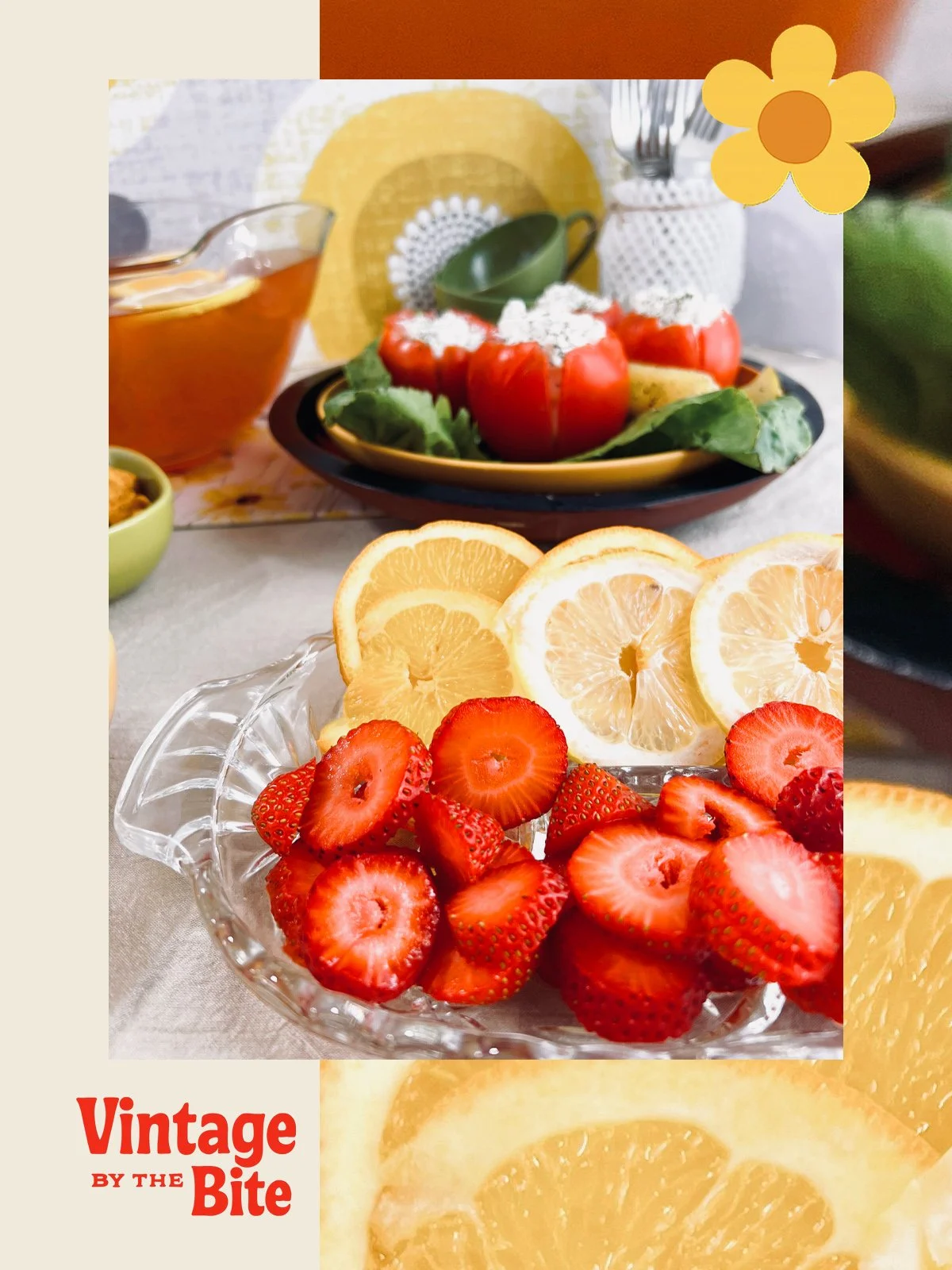 1970s-style summer table setting with sliced strawberries, lemon wedges, and retro stuffed tomatoes in a golden yellow and avocado green tablescape.
