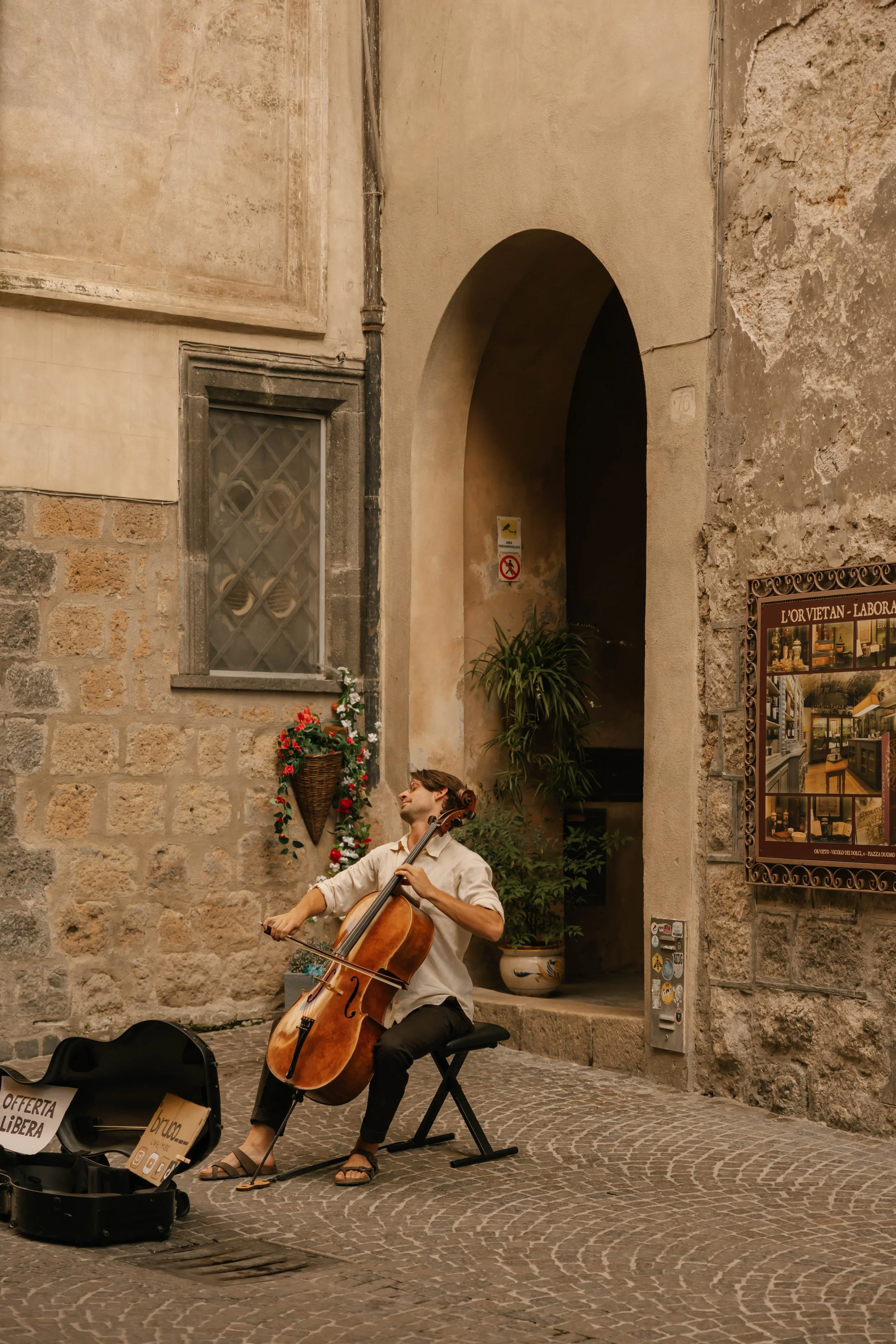 Wandering through Orvieto with no rush and no fixed agenda, just enough time to pause when a local musician fills the square with music.