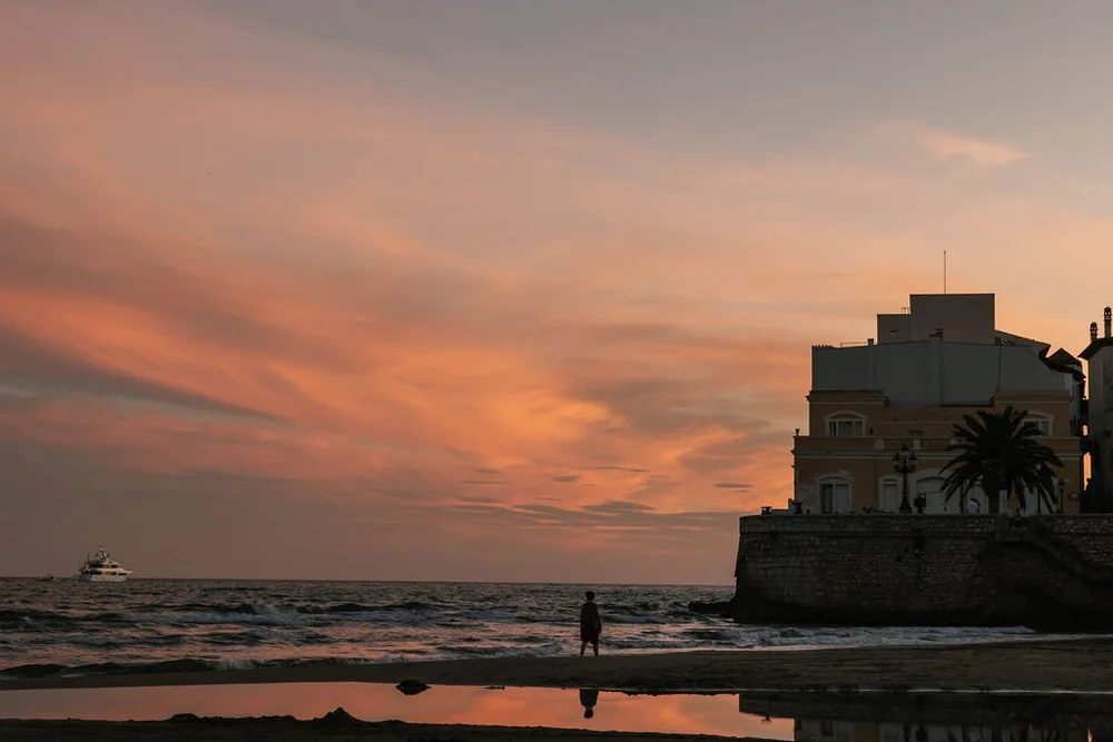 Sunset over the seafront promenade at Sitges