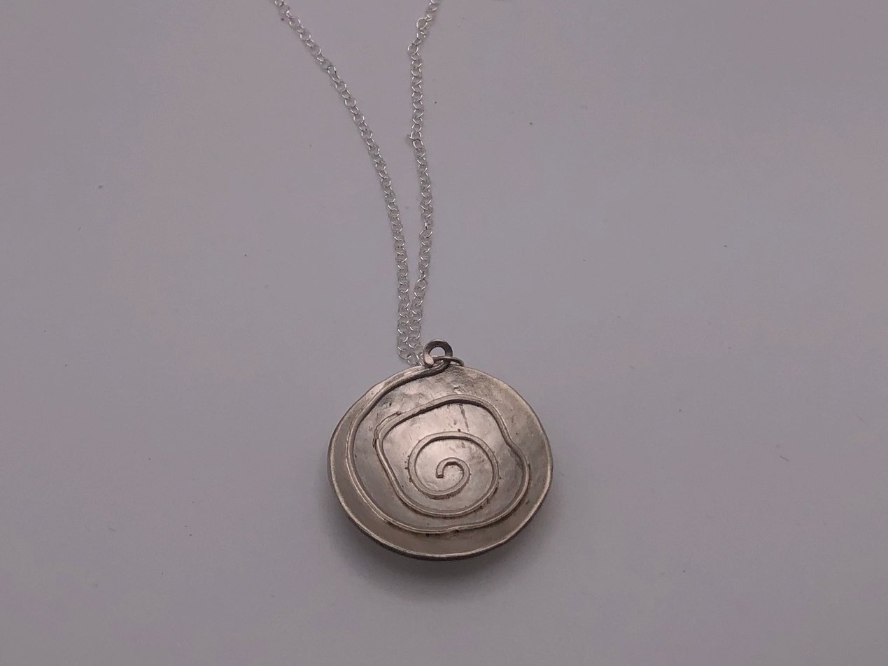 domed silver spiral necklace.jpeg