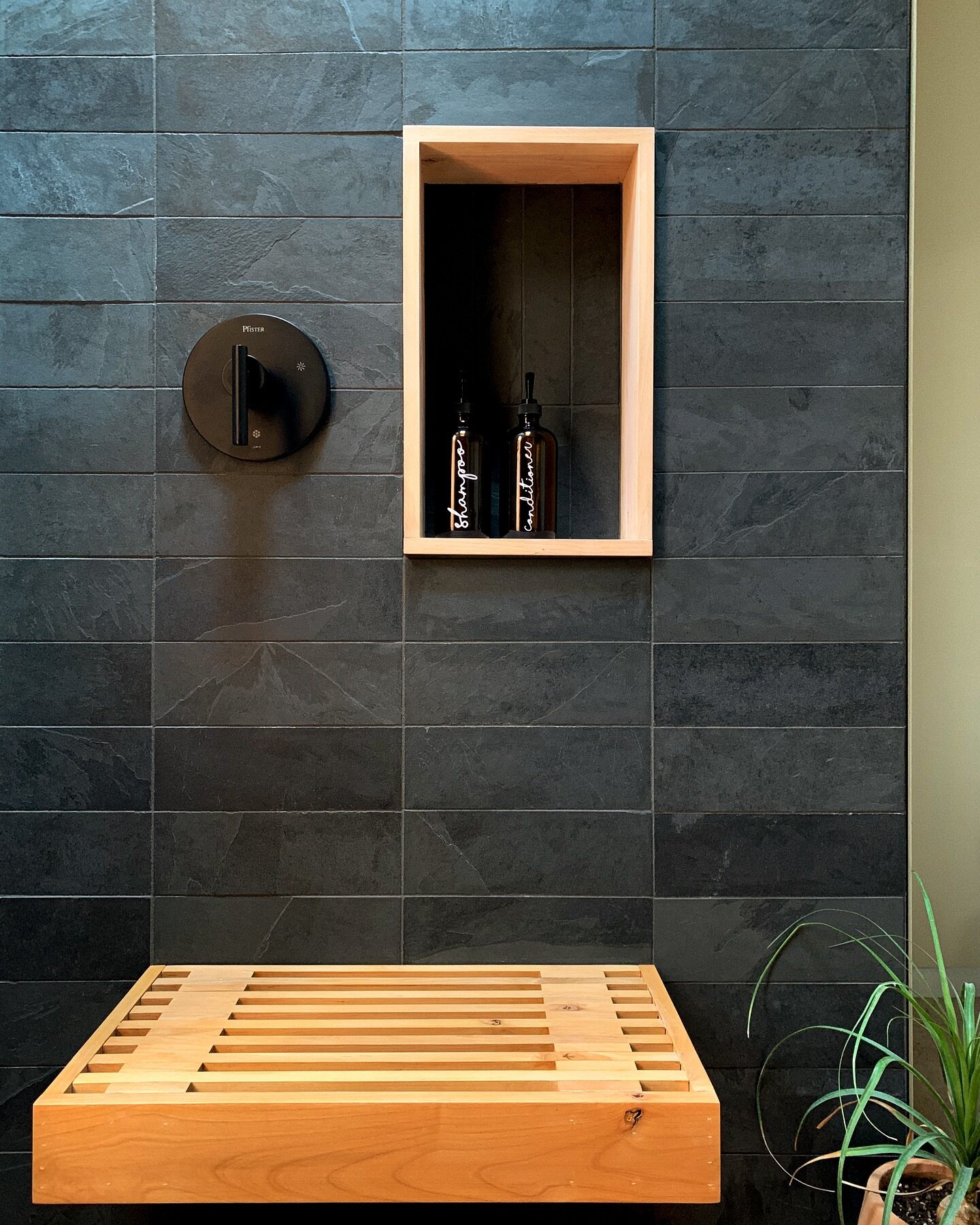 custom floating alder wood shower bench with matching trim for the soap niche. paired with slate 4x12 tile, this bathroom has a nice warmth &amp; earthiness ✨
#studio_collab #interiordesignfirm #yellowkitchen #bathroomdesignideas #bathroomdesigninspo