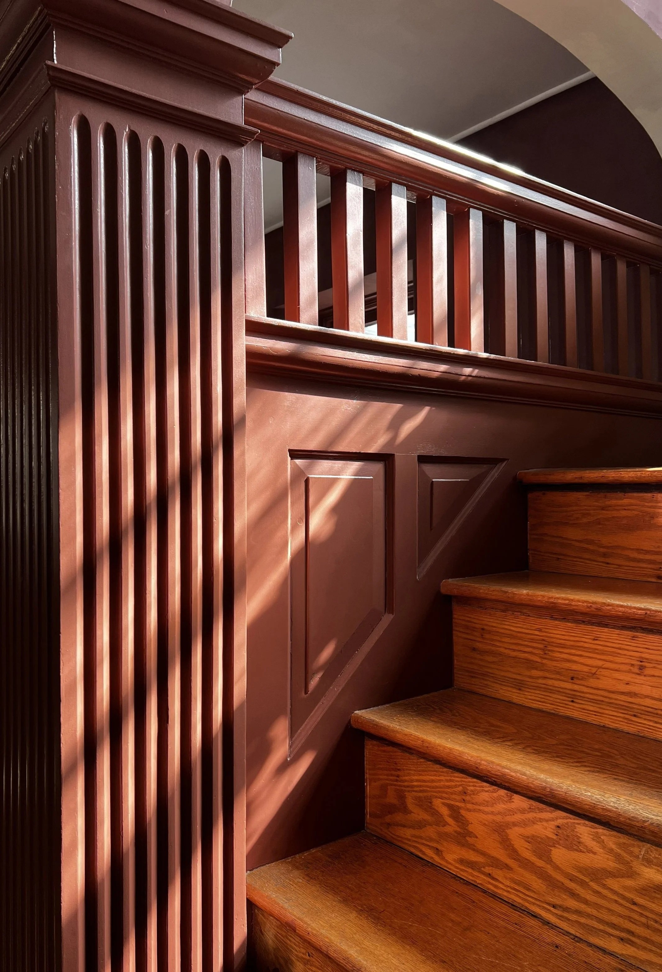 Modern interior design for transitional Philadelphia home. High end aesthetic and moody style for this foyer and stair.