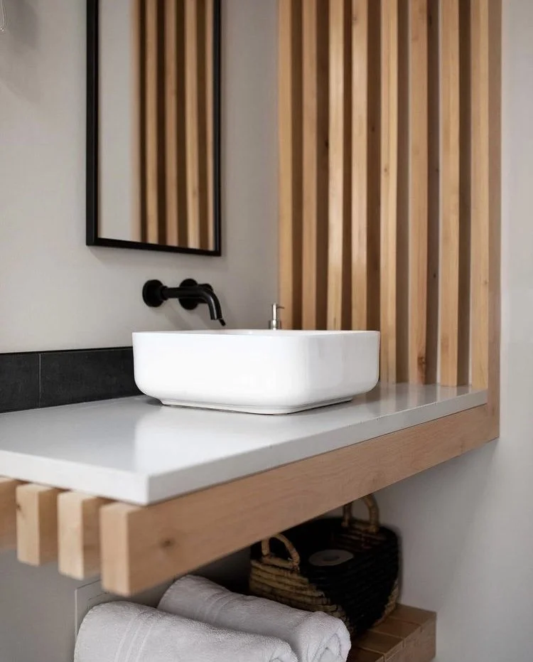 modern and custom interior design of bathroom with floating vanity and shelf for vacation rental use by design build firm in joshua tree for vacation home design