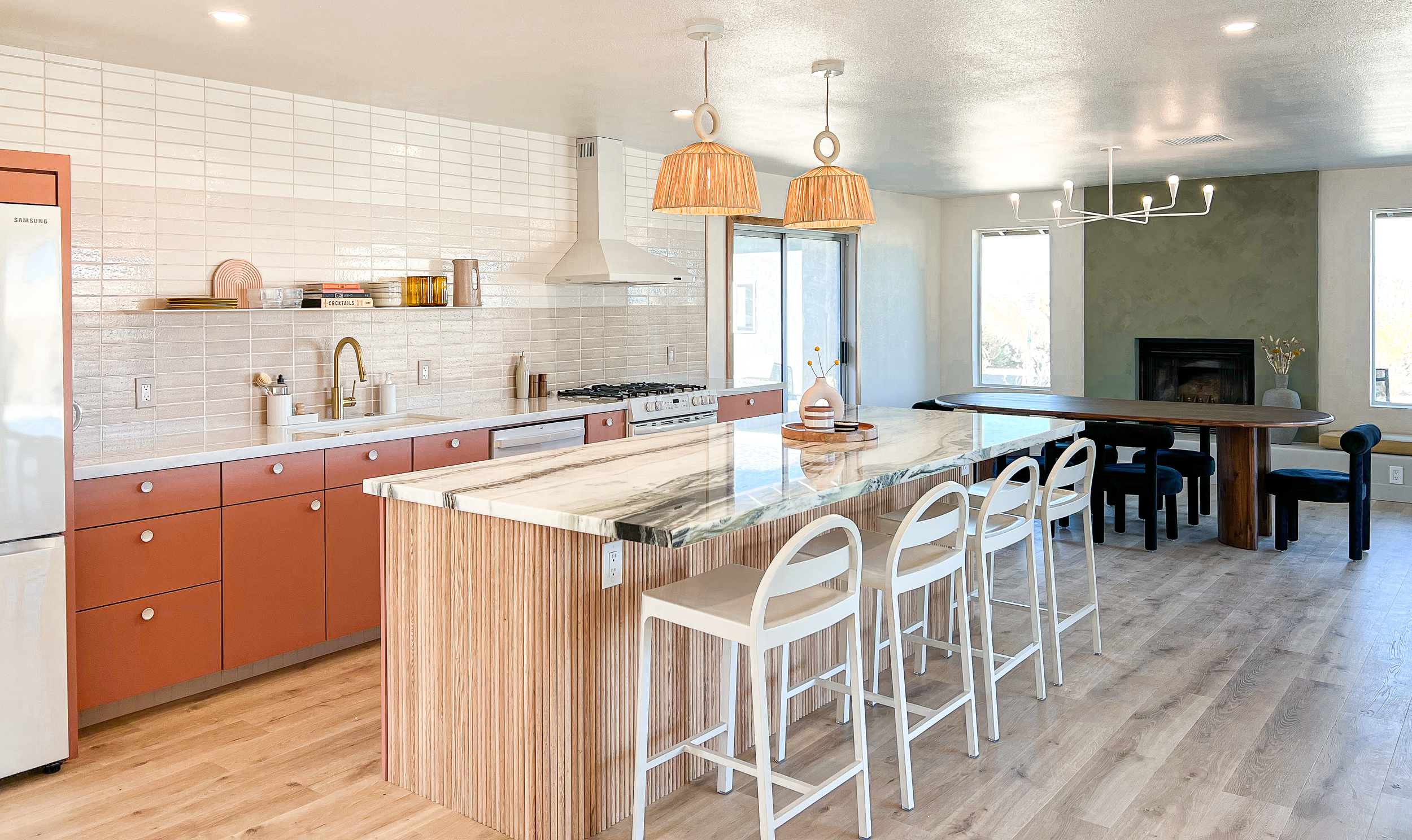 modern and airy pink kitchen and dining room interior design with custom elements by design build studio in joshua tree california for vacation home design