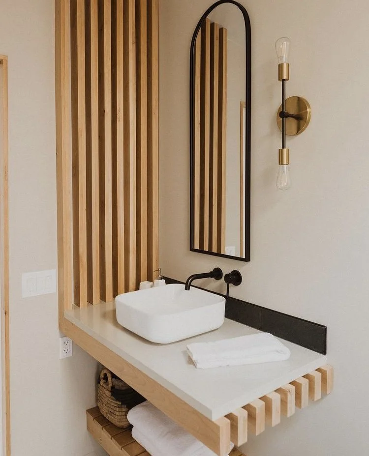 modern and custom interior design of bathroom with floating vanity and shelf for vacation rental use by design build firm in joshua tree for vacation home design
