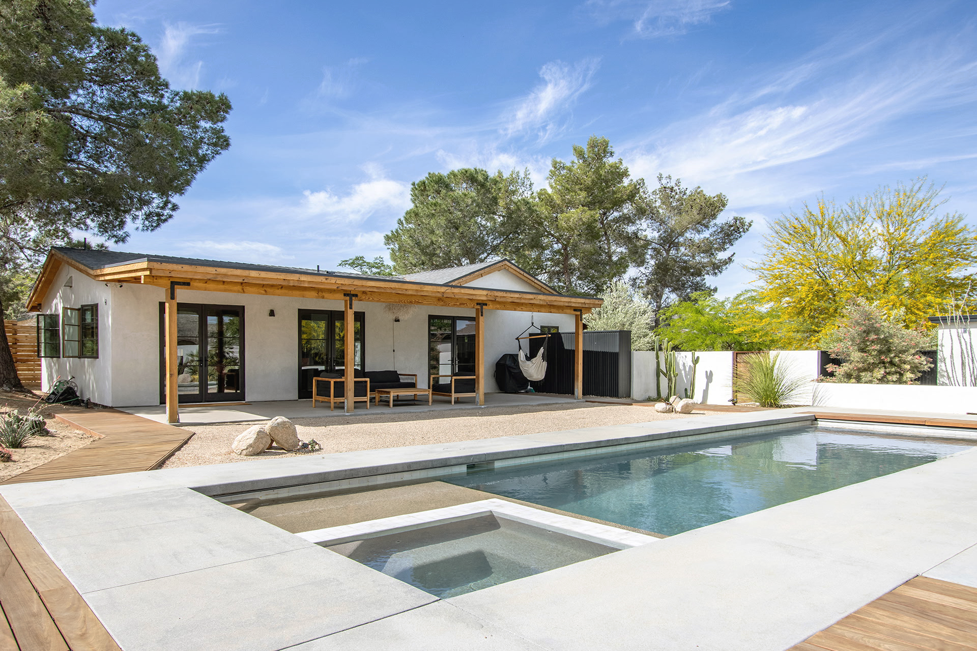 high end Joshua Tree landscape design for residential property with new pool and cactus garden