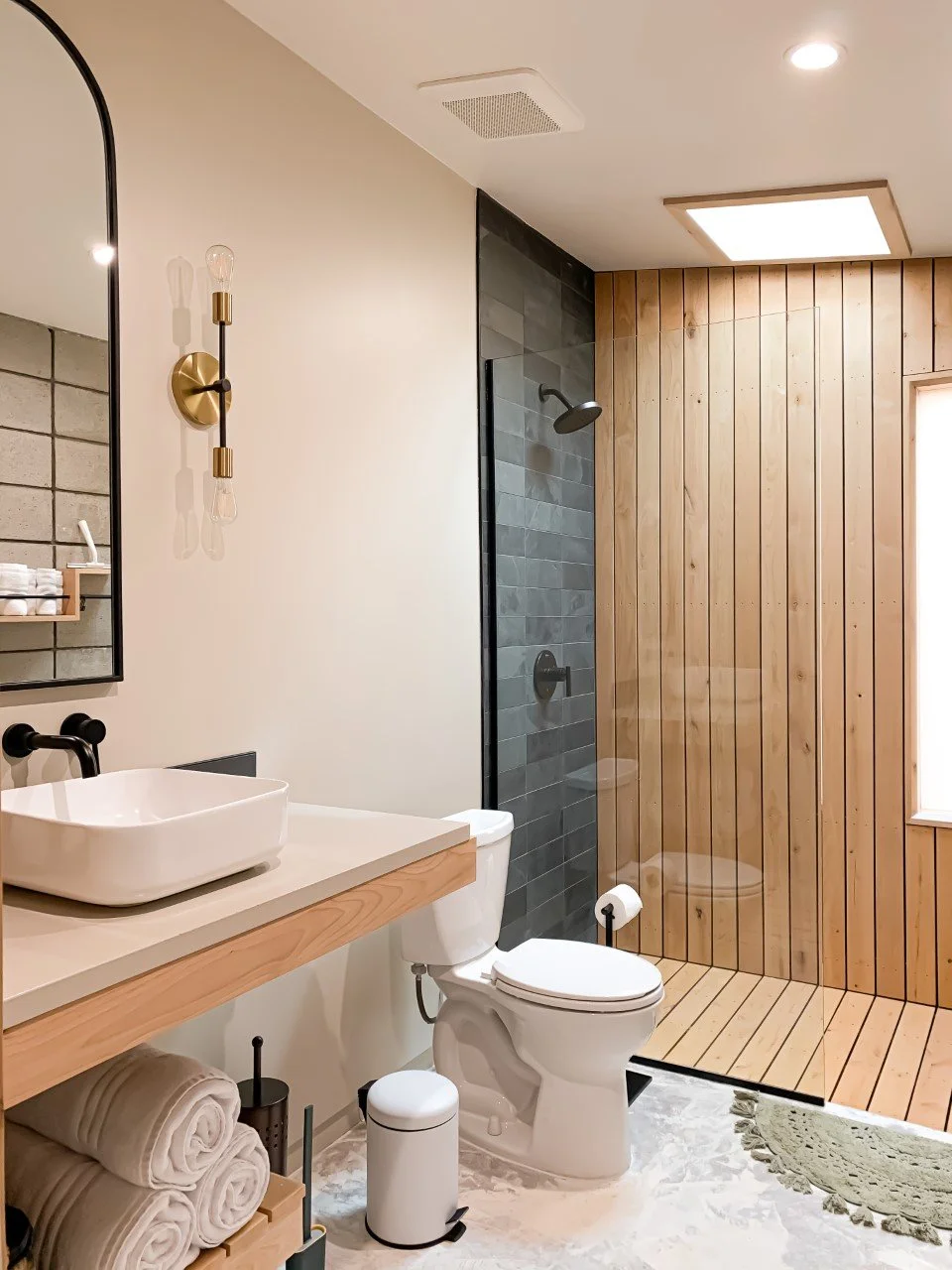 modern and custom interior design of bathroom with floating vanity and shelf for vacation rental use by design build firm in joshua tree for vacation home design