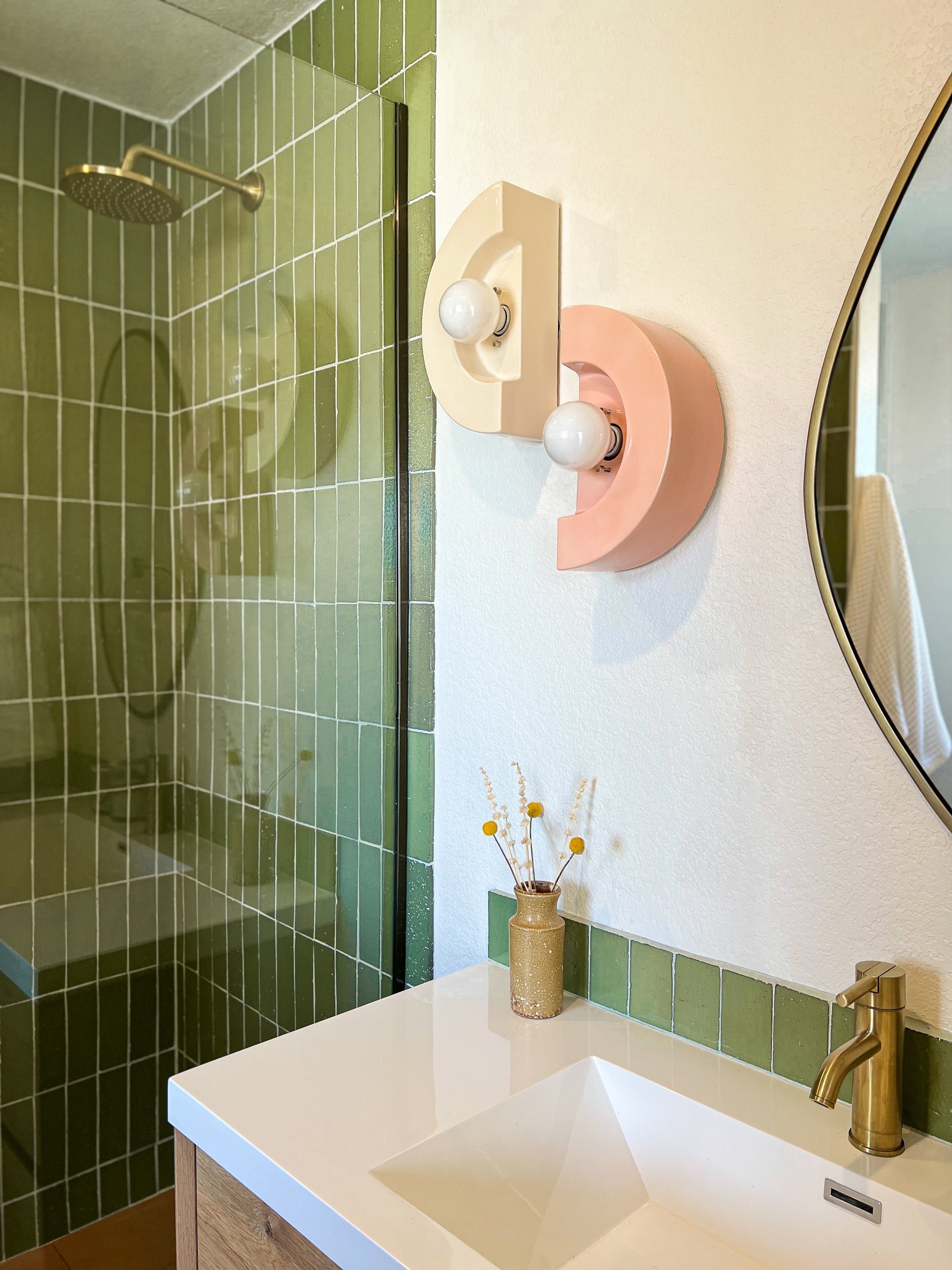 modern green bathroom interior design with ivory and blush accents by joshua tree california design build firm for vacation home design