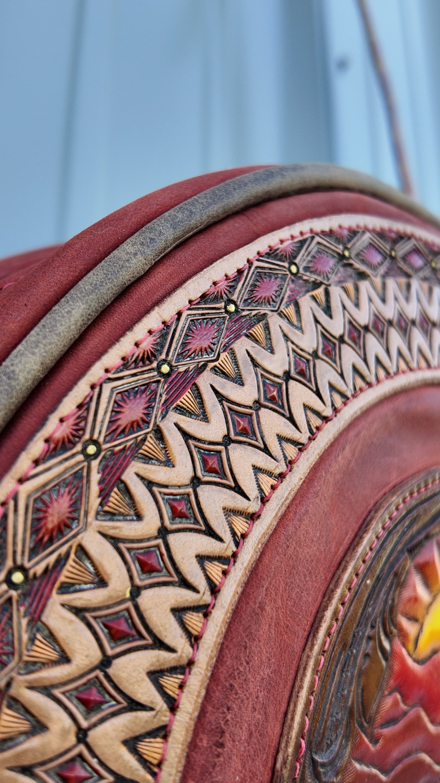 hand-tooled hand-painted geometric pattern on canteen round purse western
