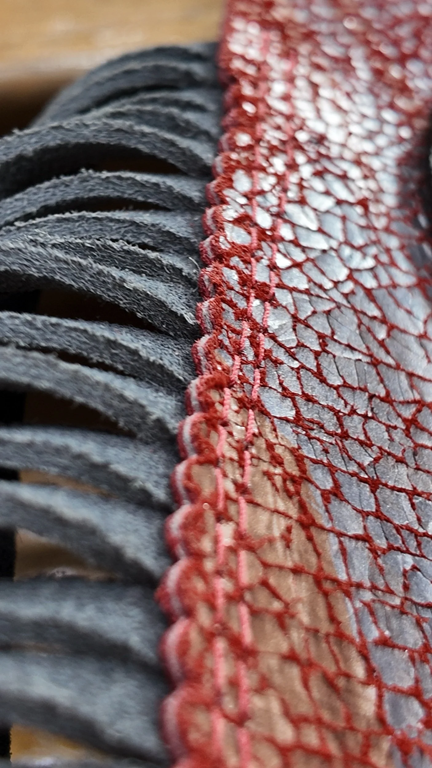scalloped leather double stitching red crackle leather grey fringe