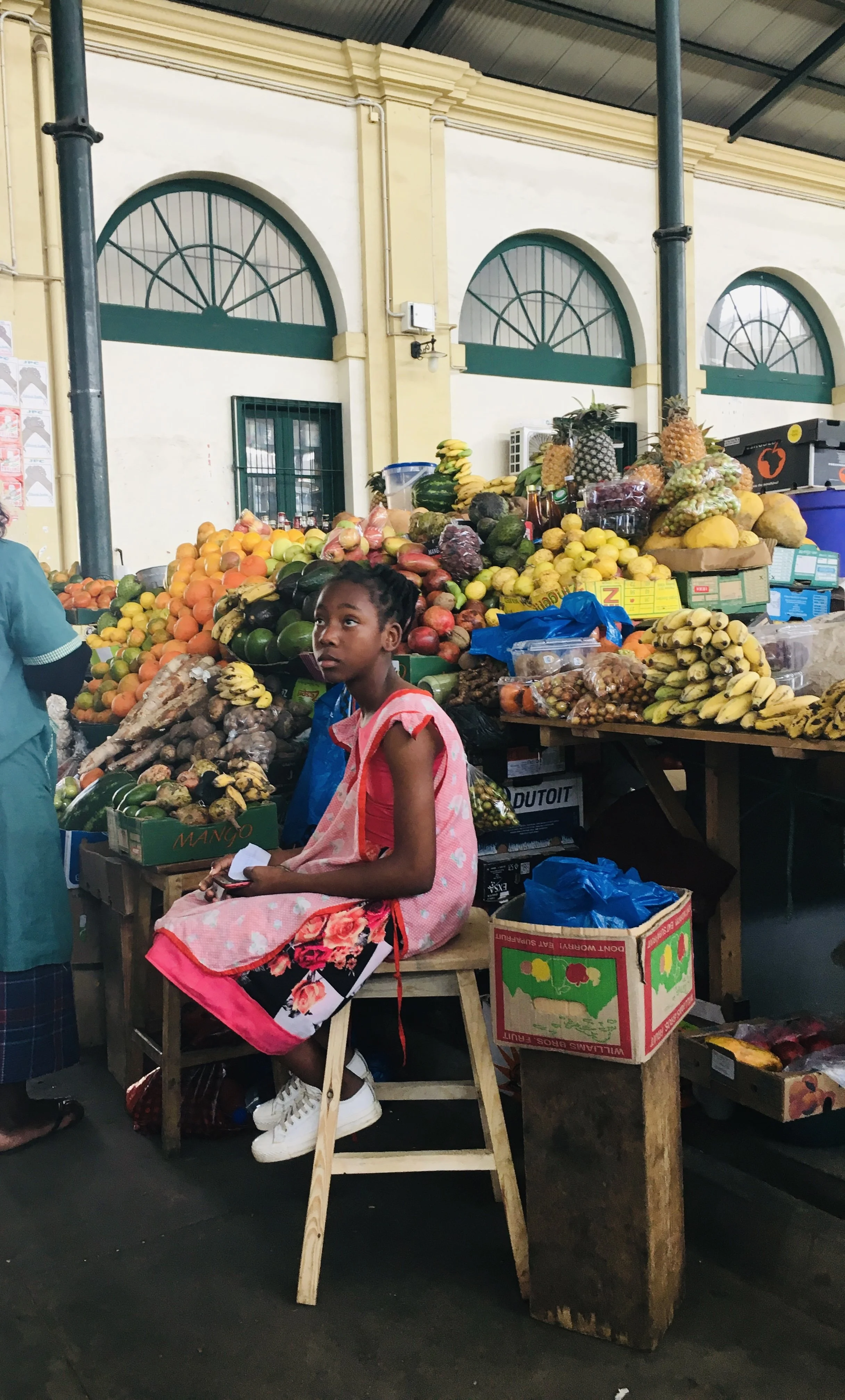 Girl in fruit market Mozambique.jpg