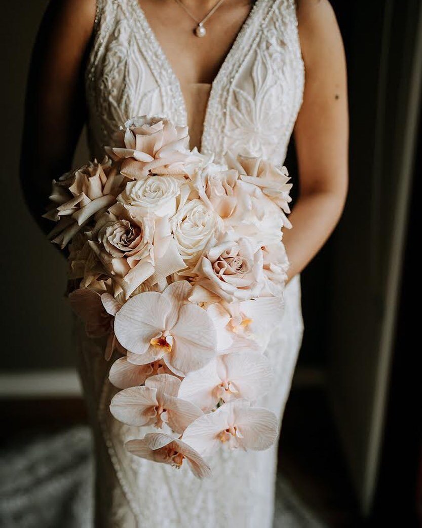 Orchids and Roses for the beautiful Mel! How incredible does that dress look?! Absolutely love the detail 😍 photo by @marcelthephotographer