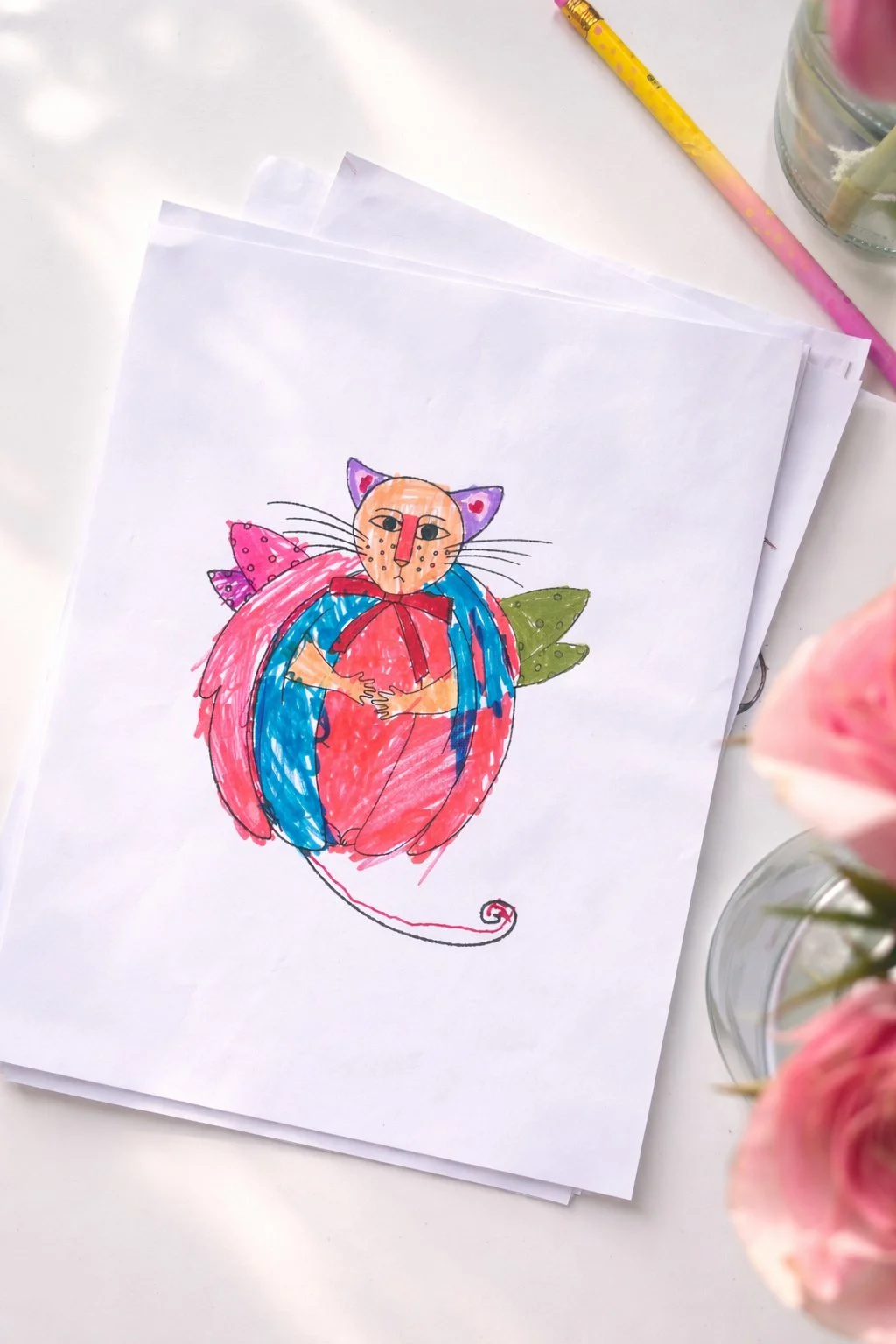 Colorful cat drawing on paper.jpg