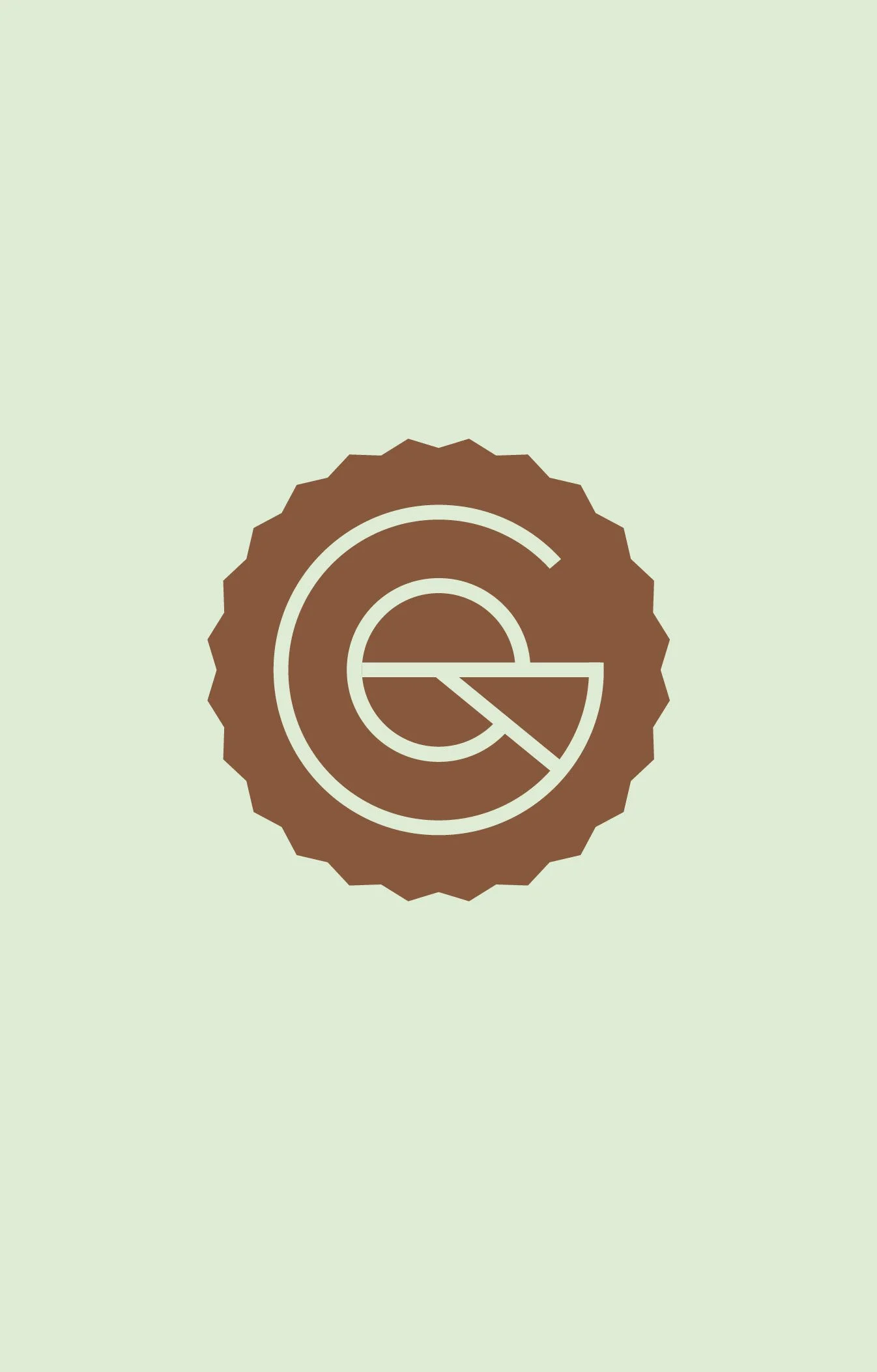 A badge with a scalloped edge featuring a brown and cream logo with the letter 'G' and a stylized 'Q' inside.