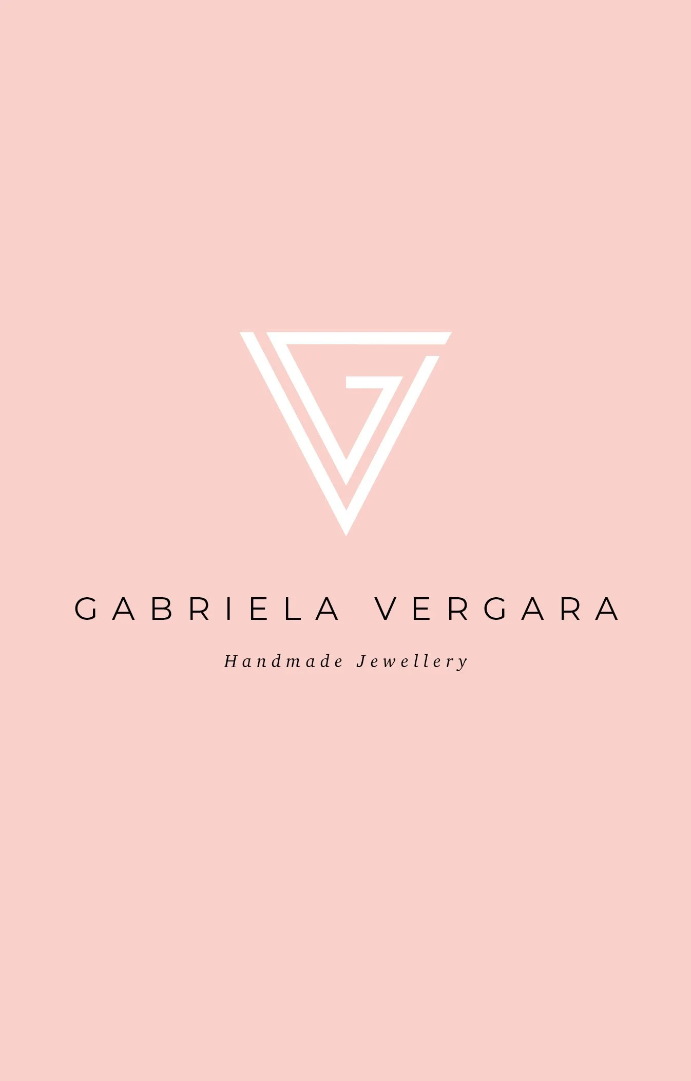 Business card with a light pink background, featuring a stylized logo of a white inverted triangle with a stylized 'G' inside. Text below reads 'GABRIELA VERGAR' and 'Handmade Jewellery'.