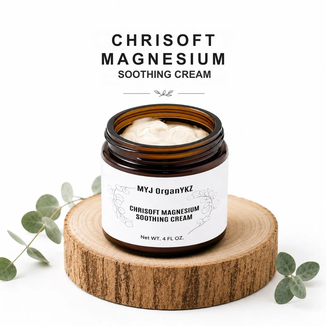 A jar of MYJ OrganY KZ Chisoft Magnesium Soothing Cream on a wooden display with eucalyptus leaves around it.