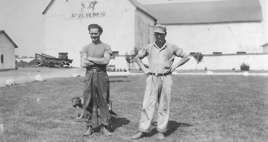 Peter Hutton on right standing in front of the Highland Dairy barn. 