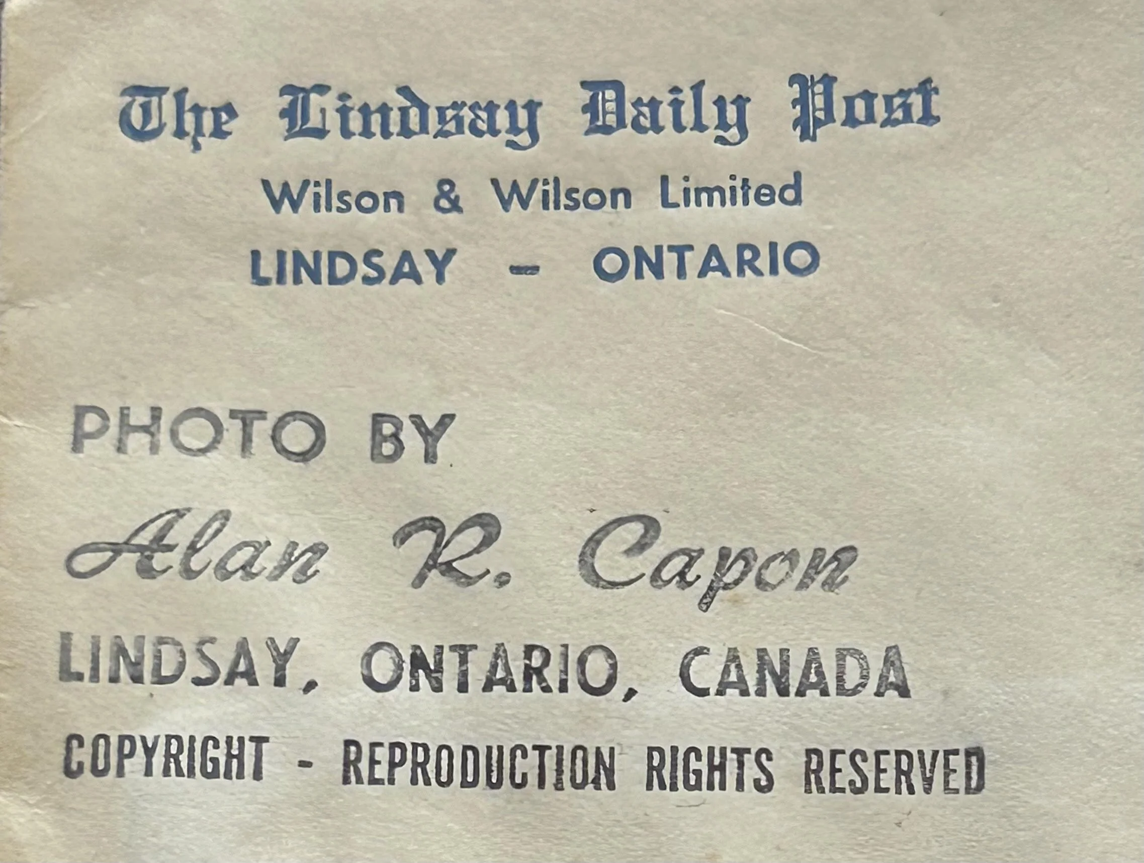 A vintage letterhead from The Lindsay Daily Post, Wilson & Wilson Limited, located in Lindsay, Ontario, Canada. It includes a credit for a photo by Alan R. Capon and mentions copyright reproduction rights reserved.