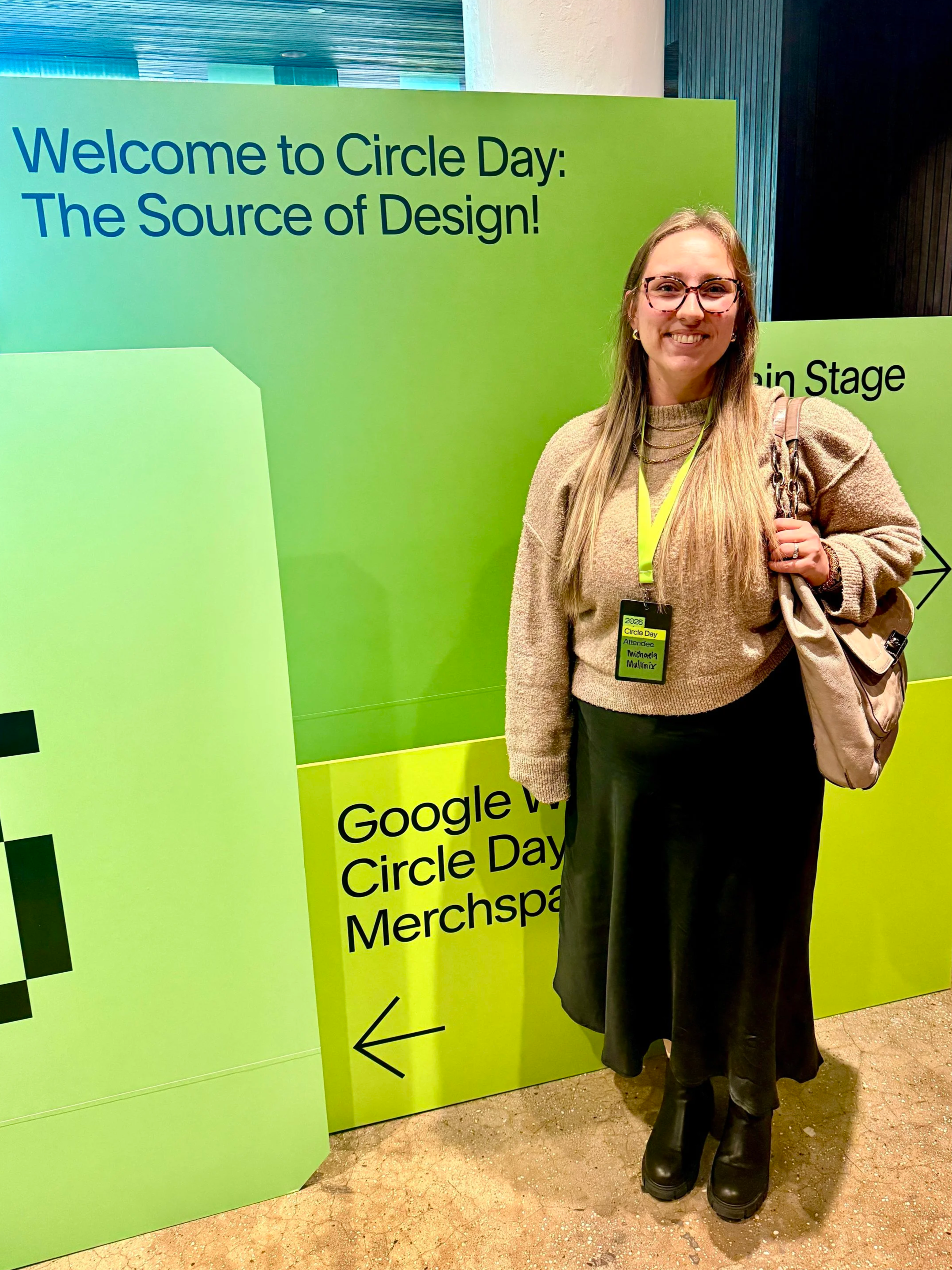 Michaela Standing with Squarespace Circle Day 2026 Sign