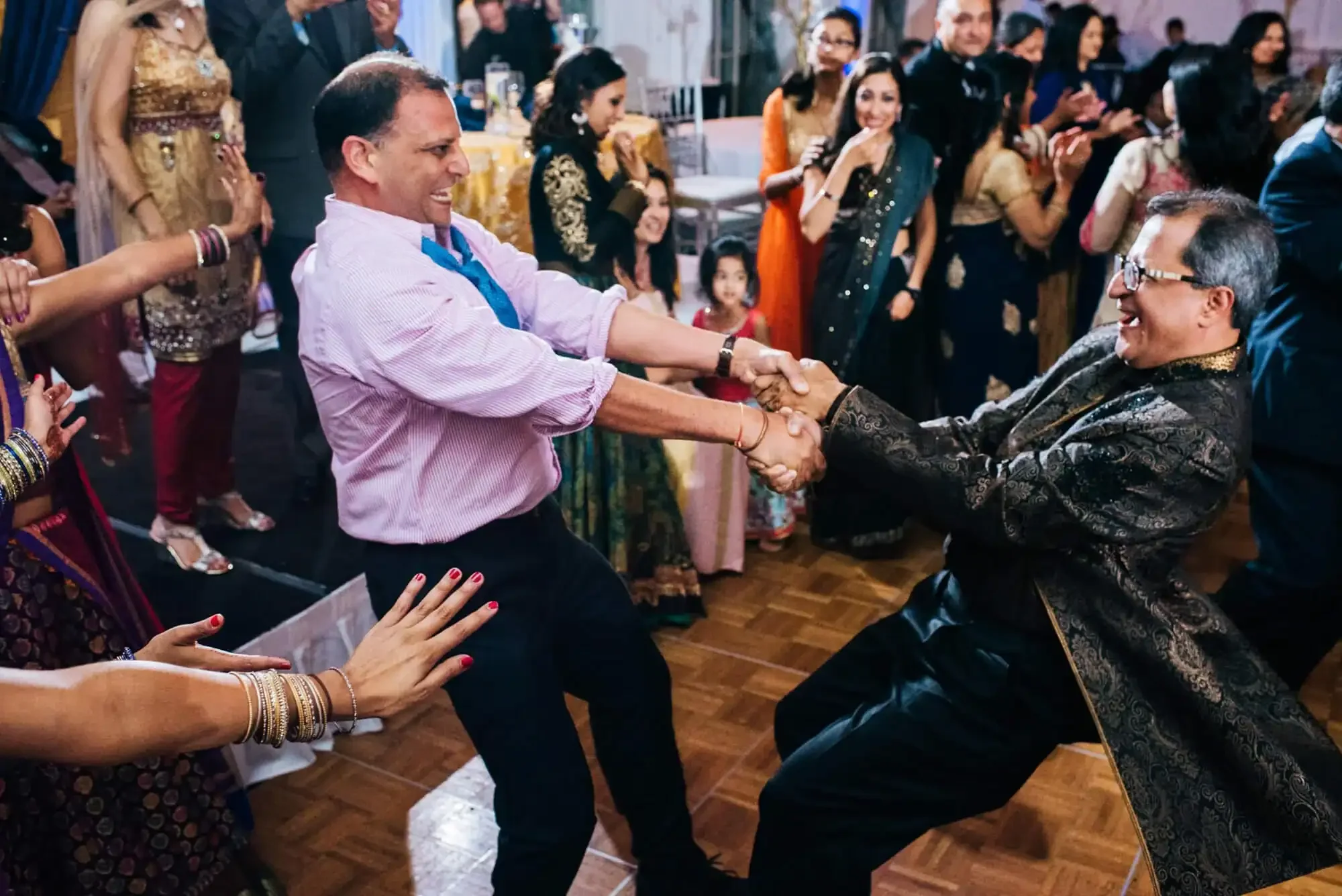 Wedding guests dancing at an Indian wedding reception at St. Louis Marriott Grand downtown. 
