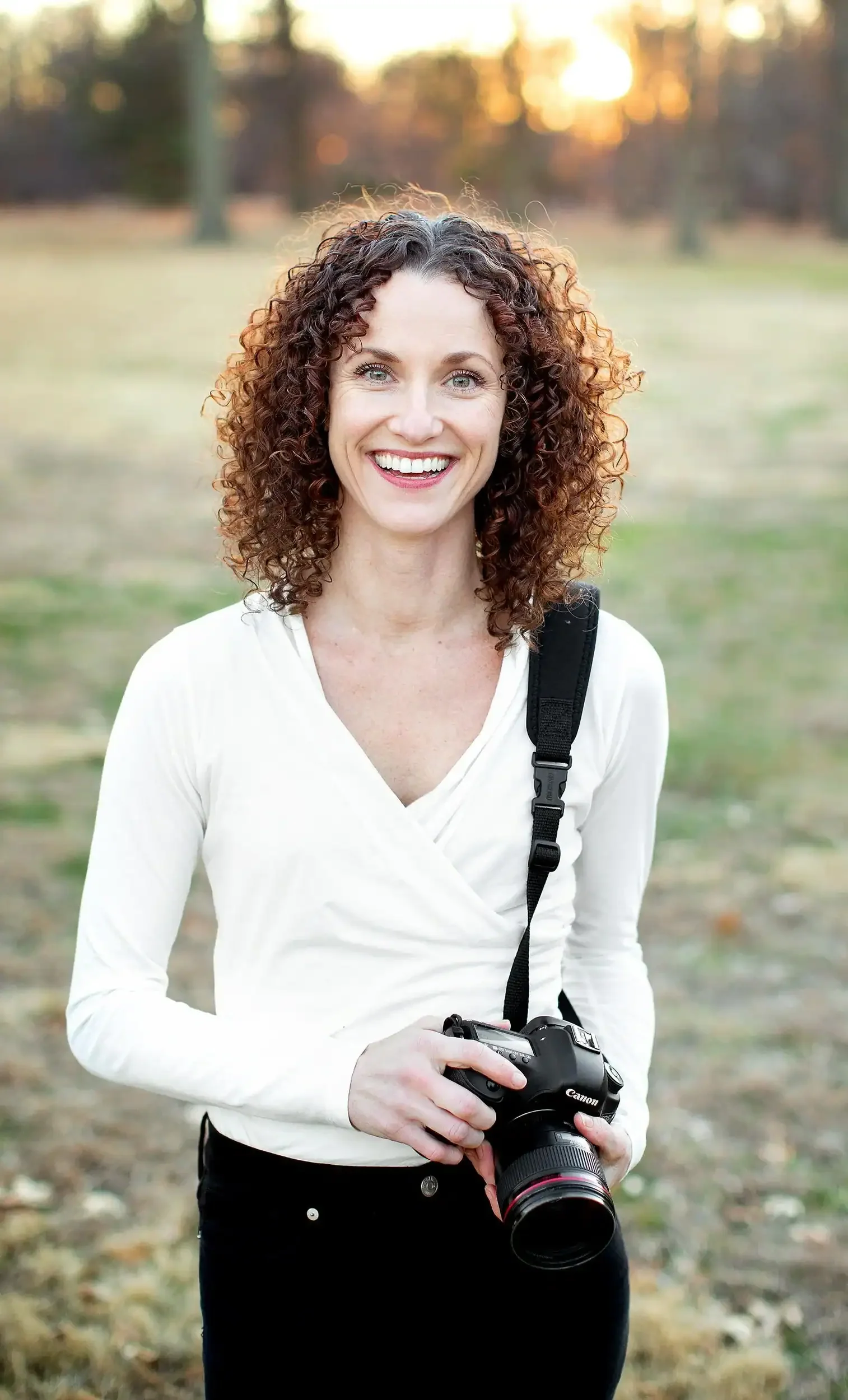 headshot photo of sarah corbett photography outside at sunset in tower grove park st louis mo
