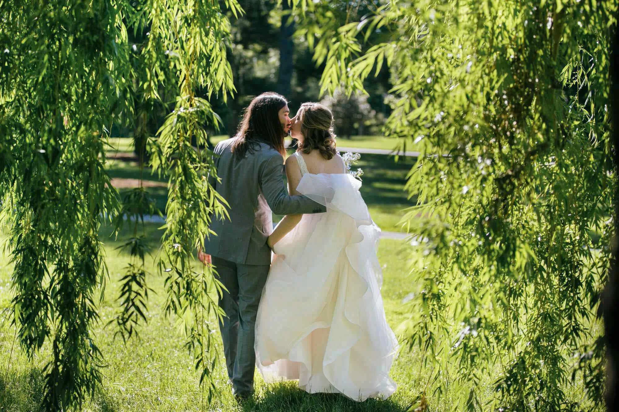 Bride-Groom-Kiss-Weeping-Willows-Forest-Park-St-Louis-Wedding_Photos.jpg