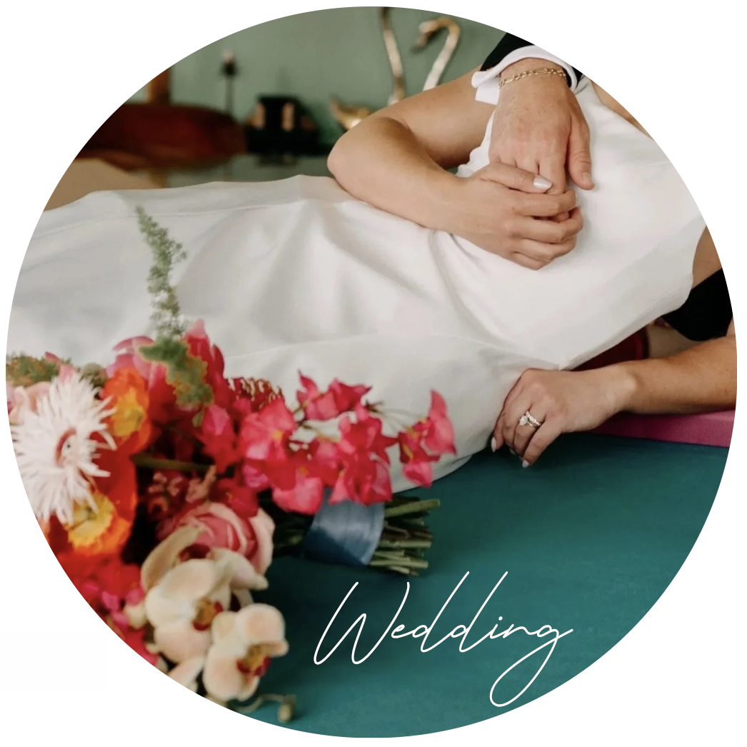Couple laying on a pool with flower at their wedding in Long Beach California