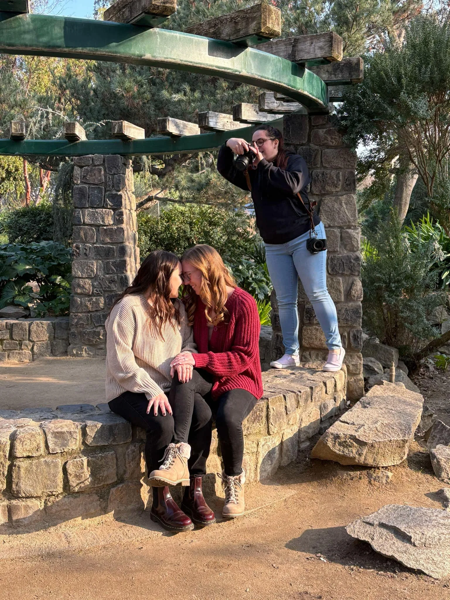 Brit Spencer of Safe Space Photo taking engagement photos of two lesbians in Sacramento CA
