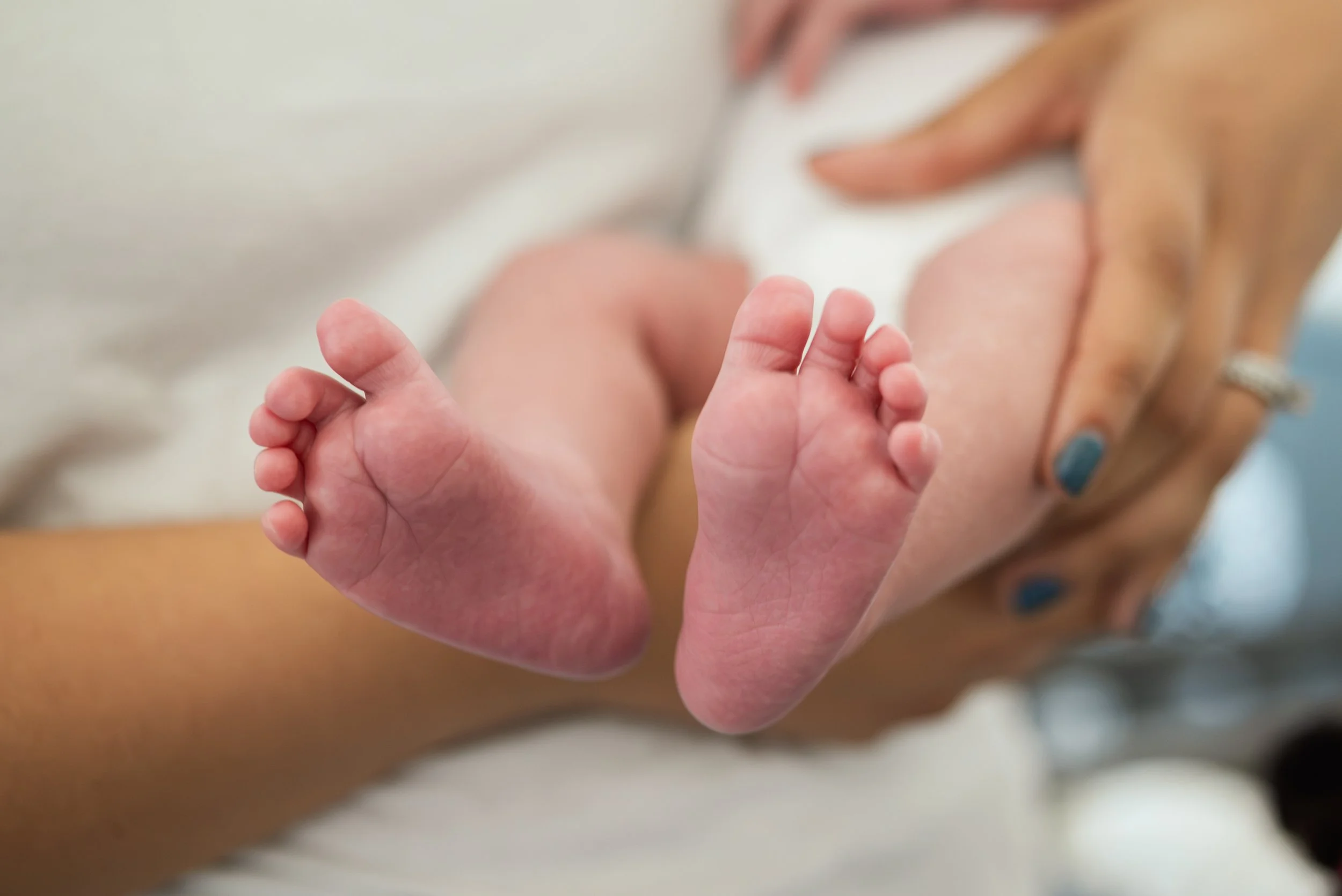 Newborn feet at a home photo session - Sacramento LGBTQ+ Photographer
