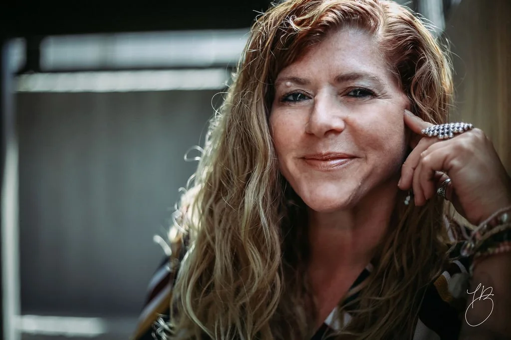 Kelly with a Big Ol' K portrait looking at camera