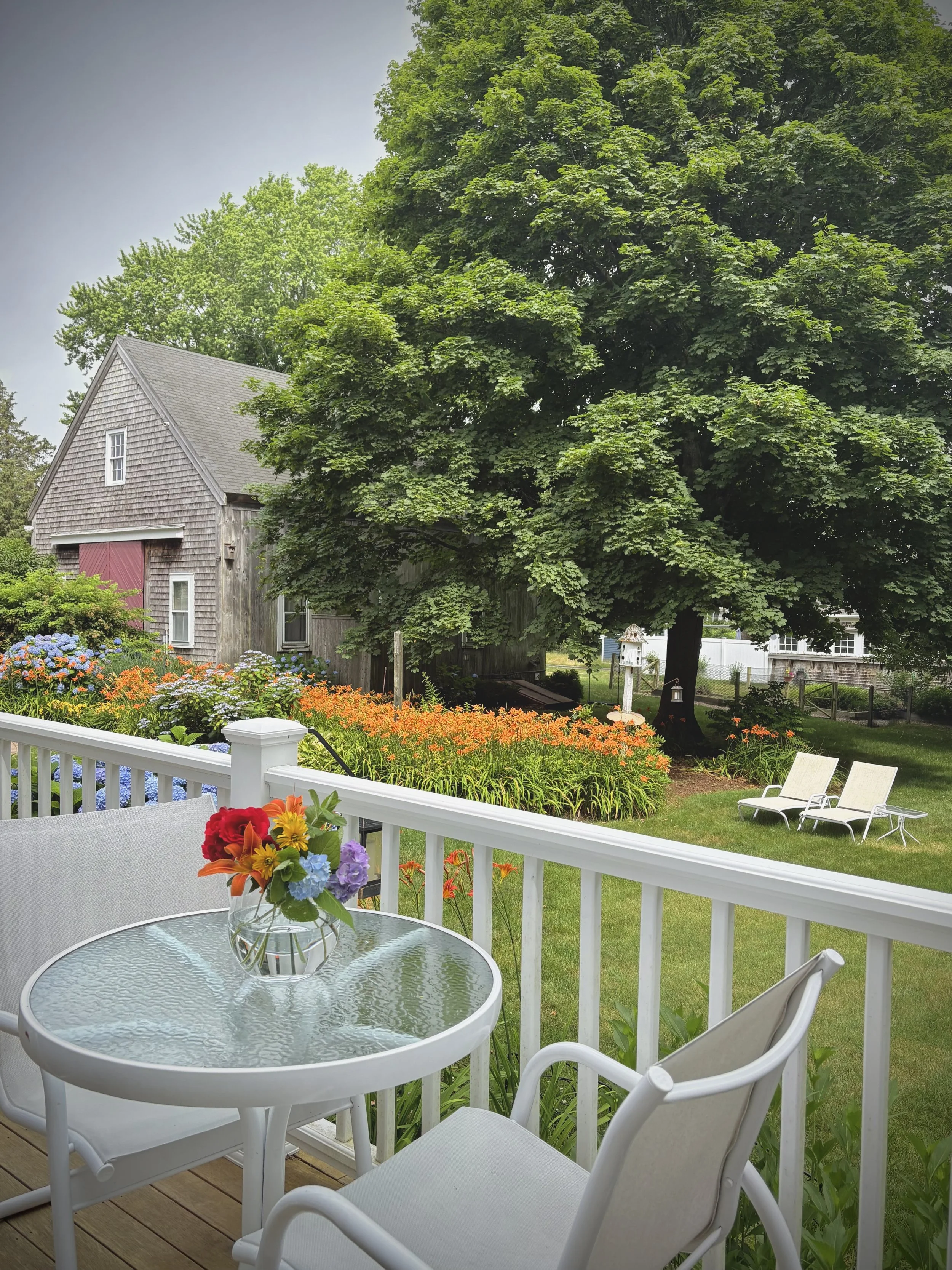 Flowers on porch table.jpeg