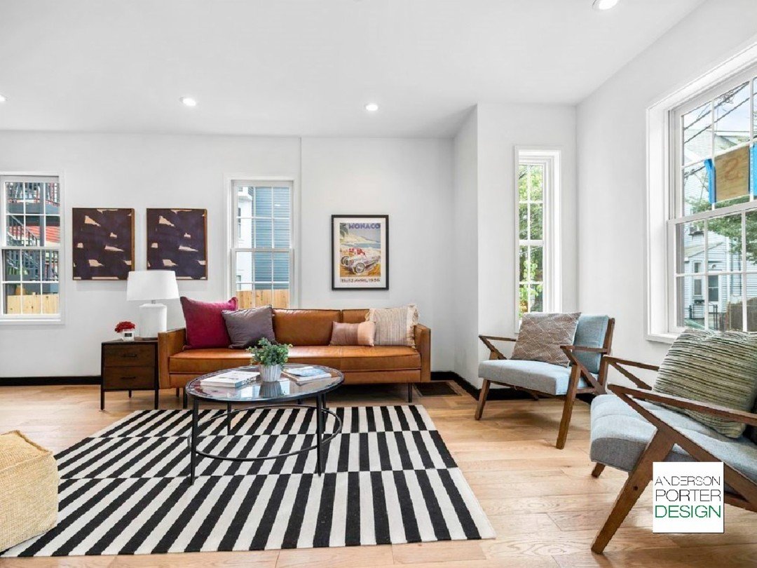 We love a carpet that makes a statement! This was a residential project in Somerville the firm had the pleasure of working on. With soft colors and cozy cushions, this space is the perfect environment to curl up and read a book or sit and chat at the