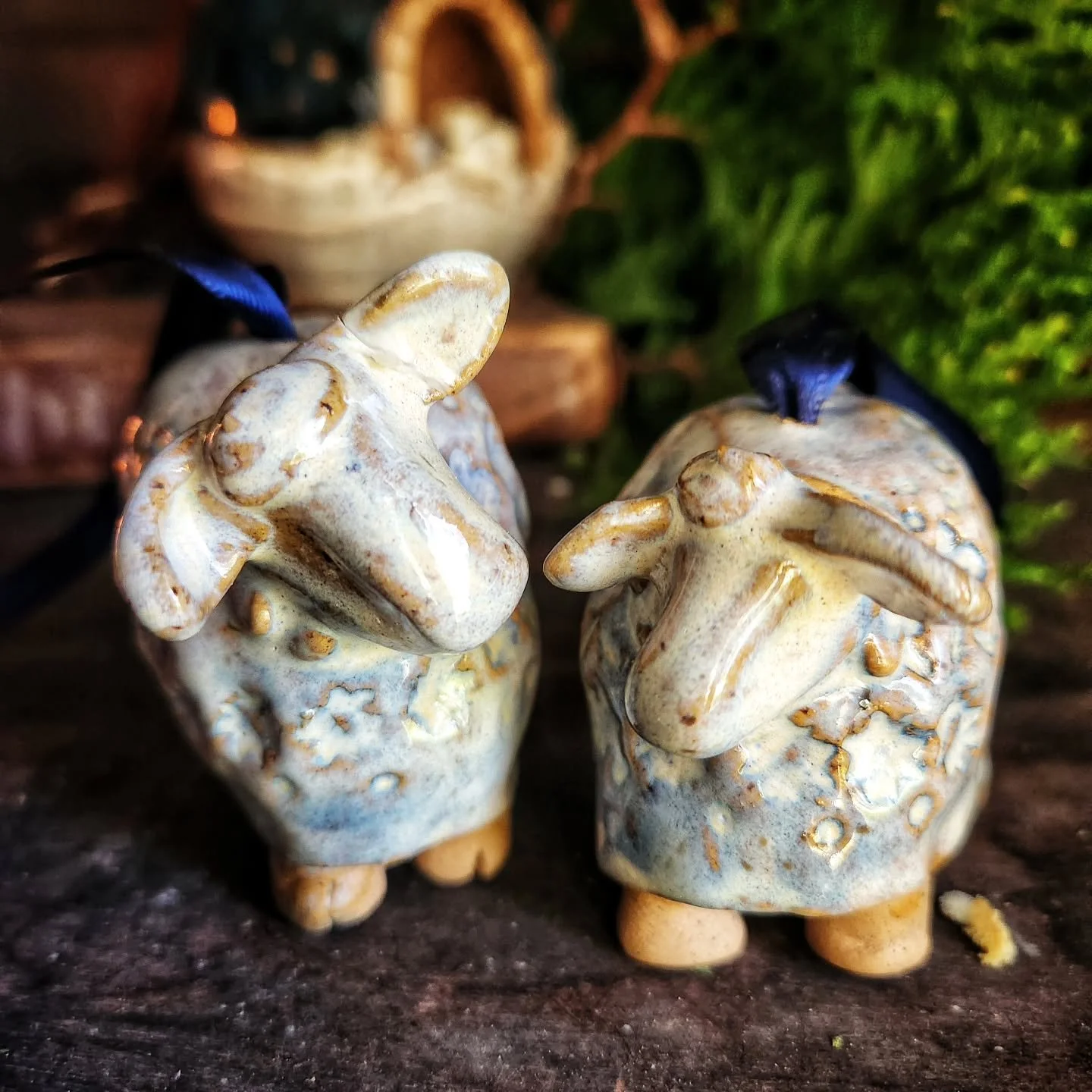 I'm working on a goodly sized stock of ornaments,  including these adorable sheep. These were such an unusual making cycle. I liked the concept in my head and on paper,  but every step in clay, i was uncertain.  I liked them a little more with each p