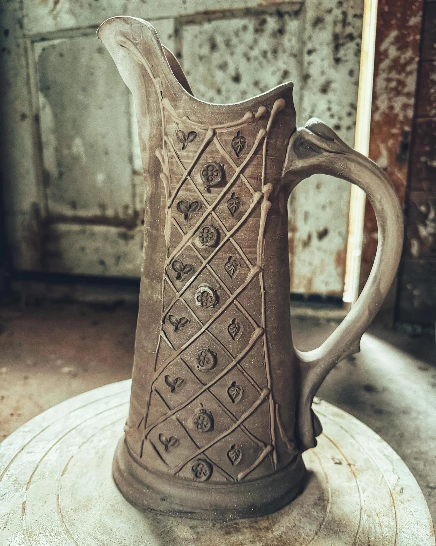 I wish I had kept track of all the times a mistake became my favorite thing. I cut through the bottom f this pitcher the other day, and decided to try to salvage it. Since I have self imposed rules about hand-building &mdash; it is for non cylinders&