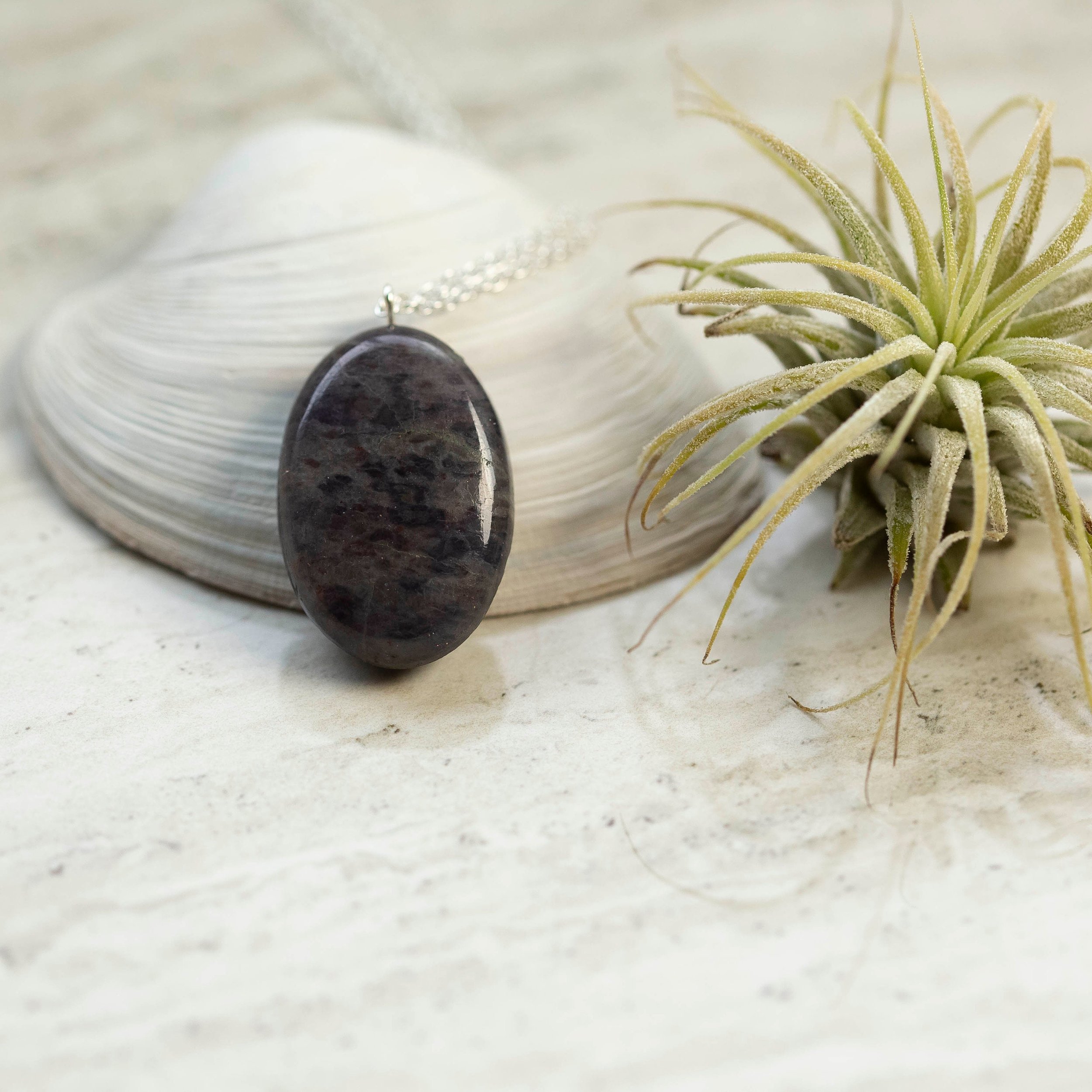 Beautiful dark blue oval Iolite Gemstone silver necklace.