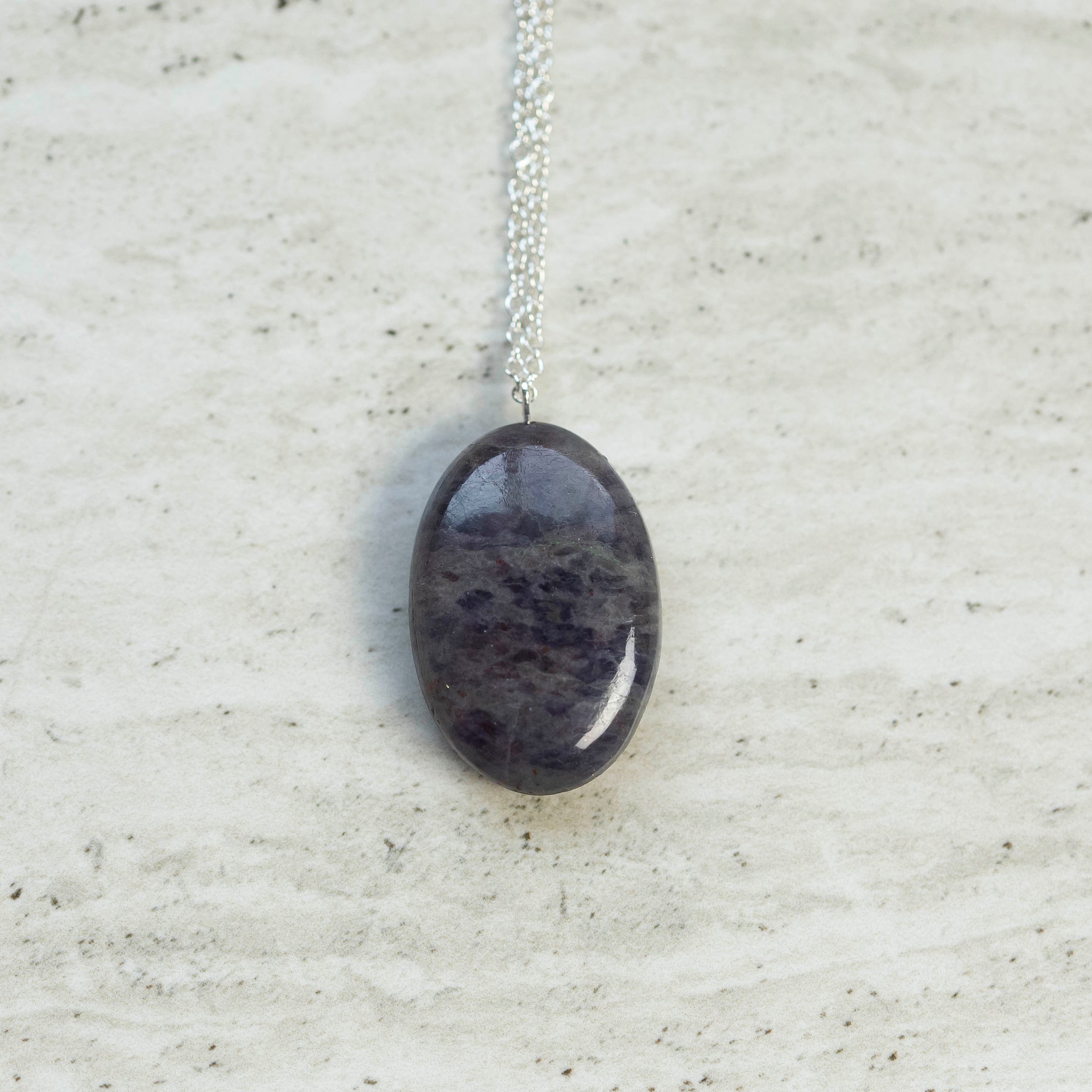 Beautiful dark blue oval Iolite Gemstone silver necklace.