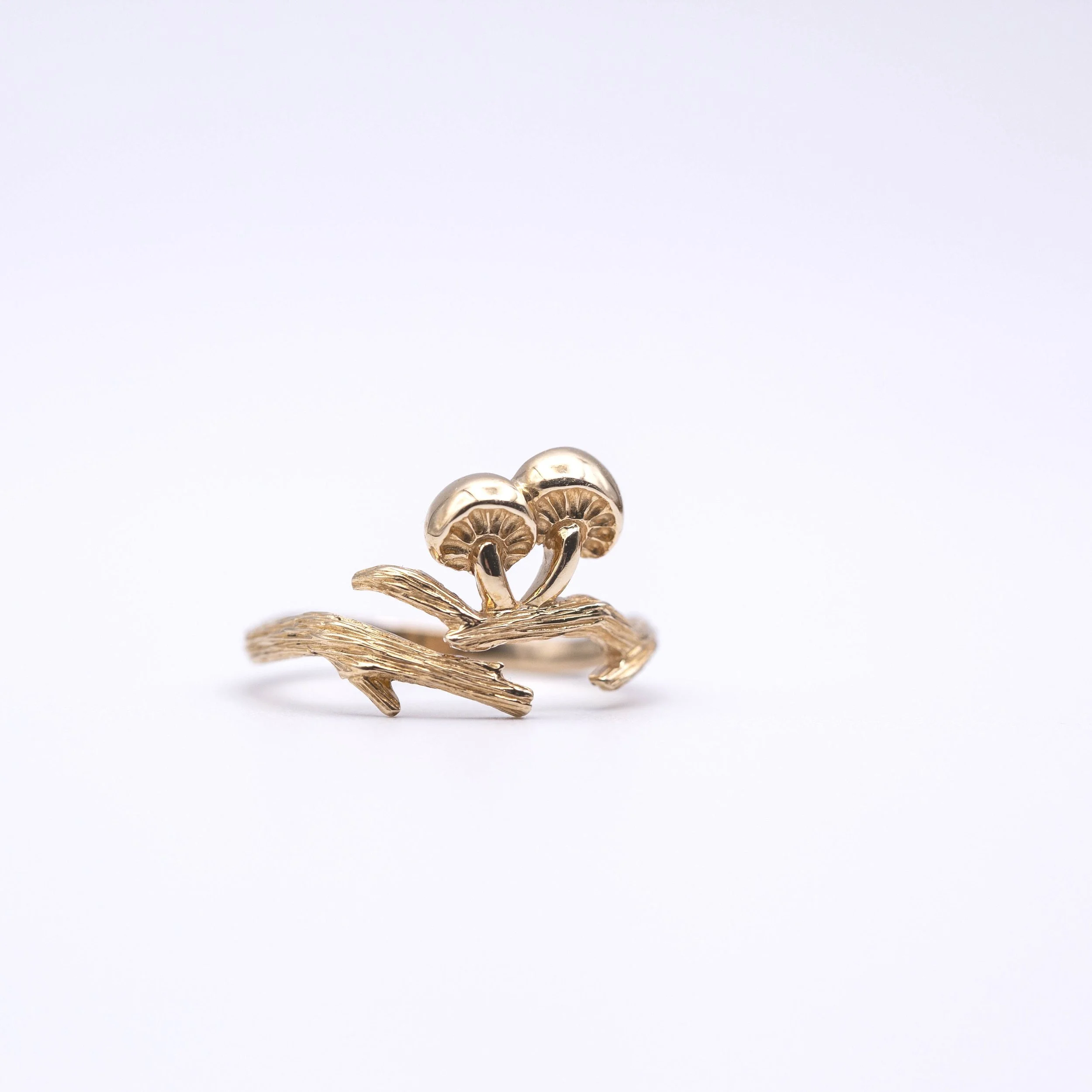 Bronze Adjustable Branch and Mushroom Ring celebrates the enchantment of the forest, a wearable tribute to the beauty of the natural world."