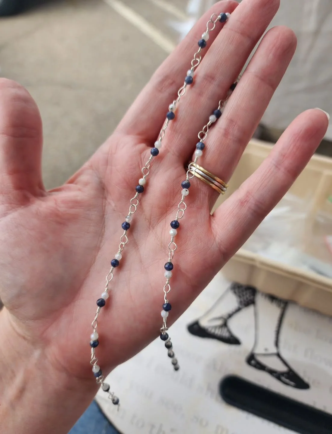 Sitting at the @farmersmarketmanhattanks making a necklace for one of my sweet customers who drops in to chat with me every Saturday 🥰 my favorite part of selling here is the connection and the conversation